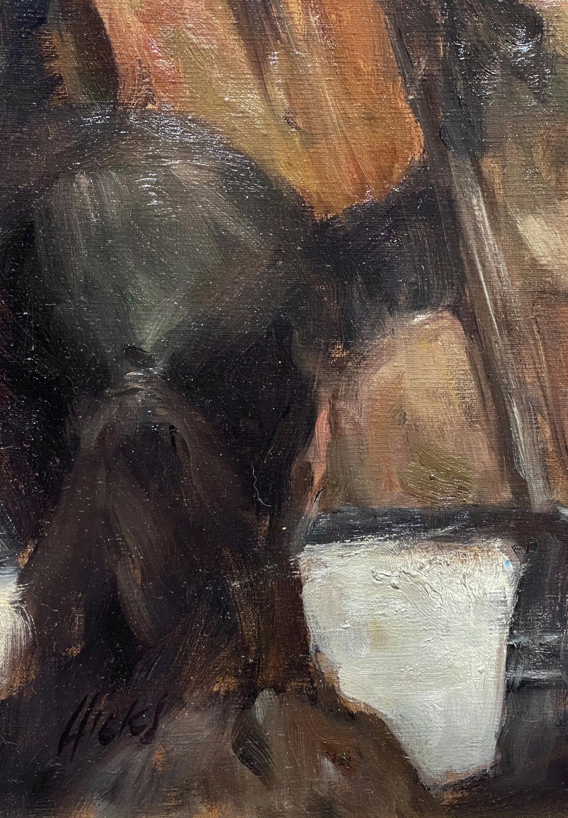 A conductor leads an orchestra in a warmly lit concert hall.