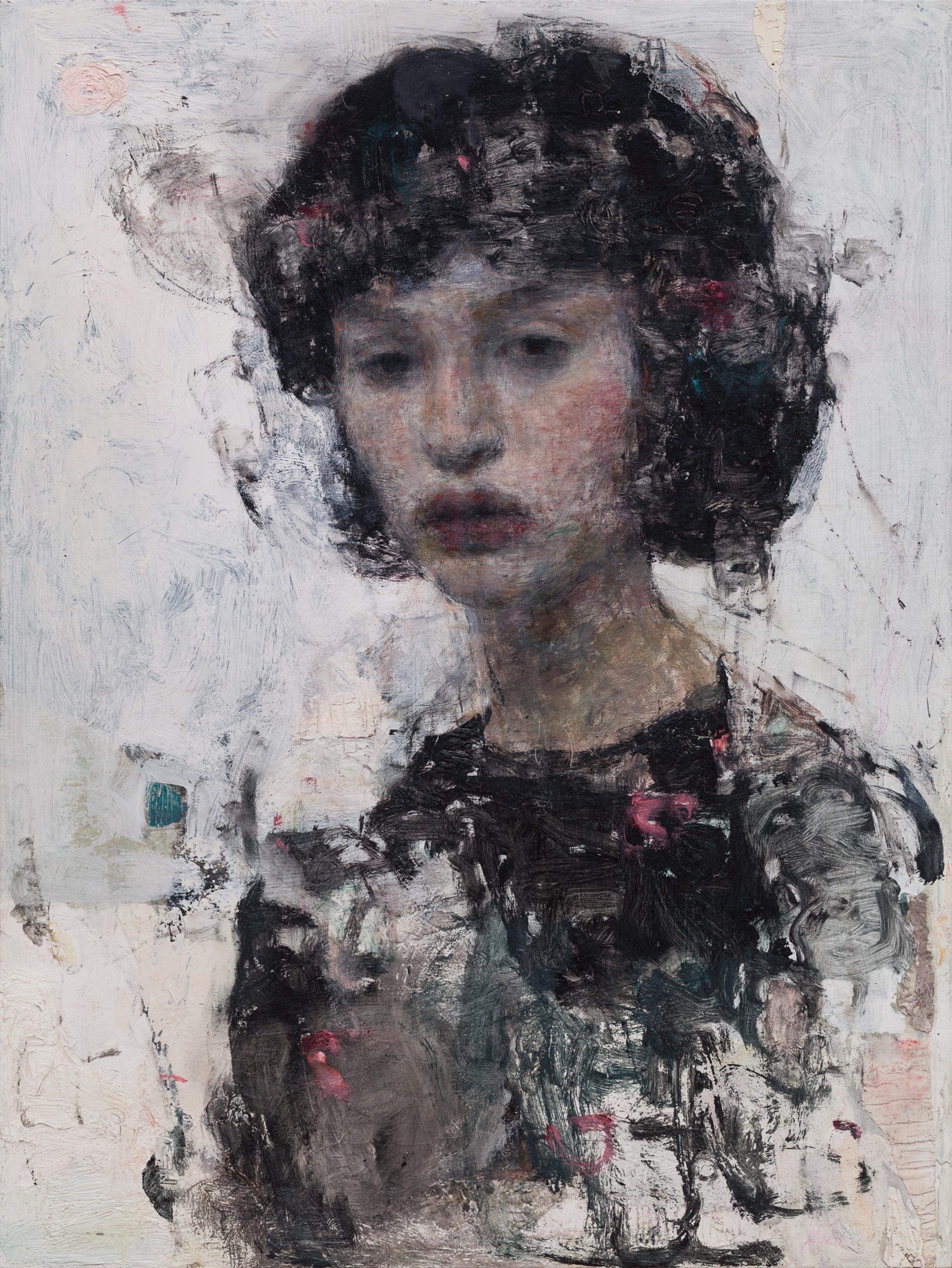 A moody portrait of a figure with dark, textured hair and a somber expression.