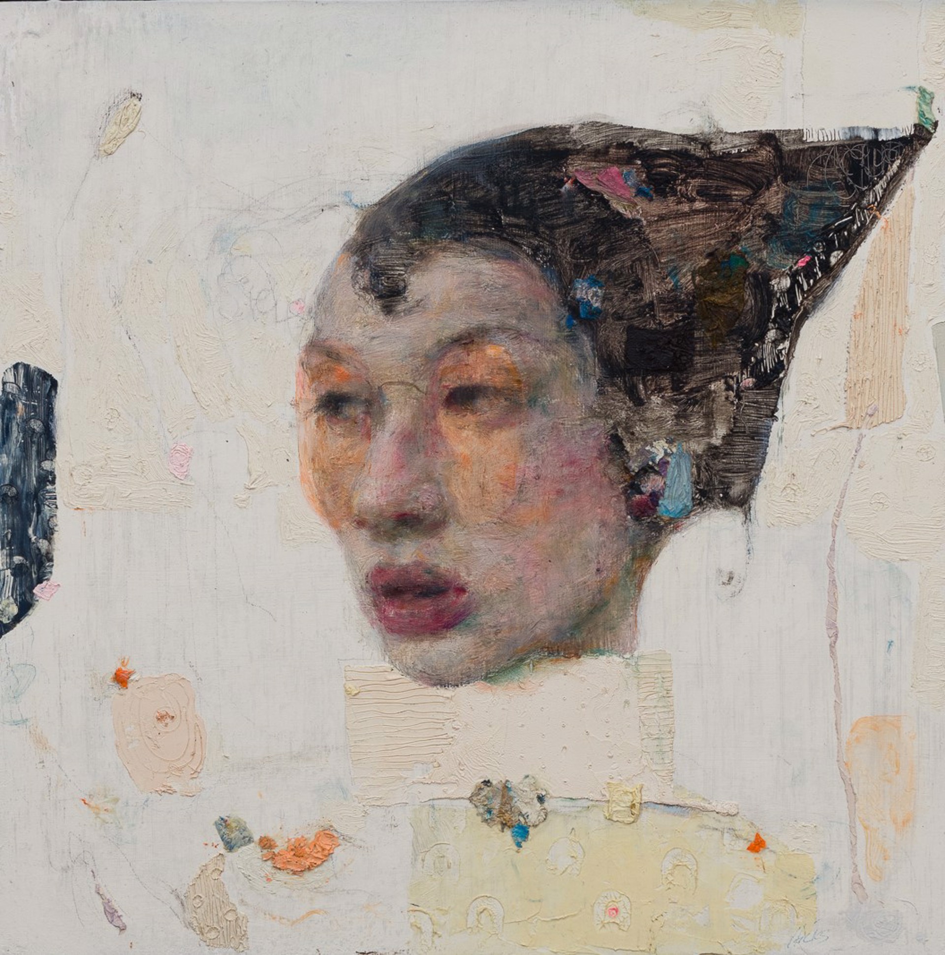 A painting of a woman's face on a piece of paper.