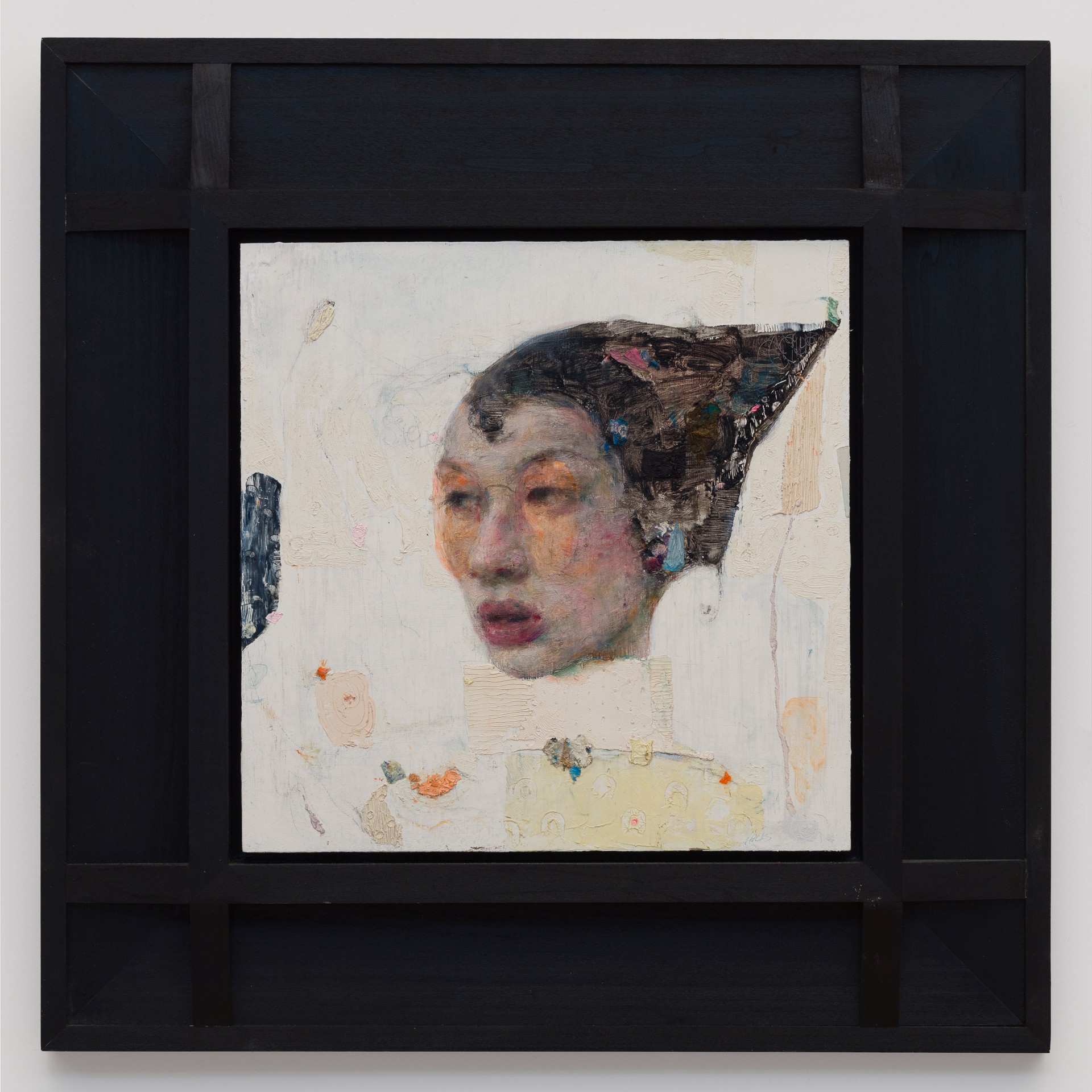 A painting of a woman's face on a piece of paper.