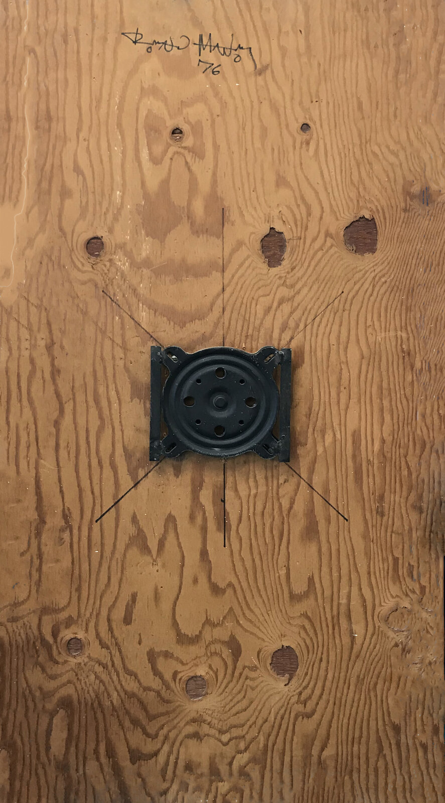 A stained glass window with a blue background and white shapes.