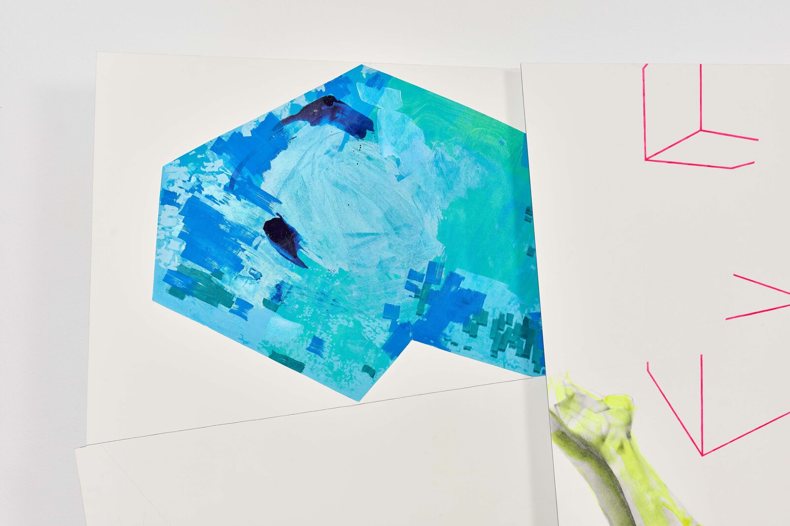 A piece of art hanging on a wall in a room.