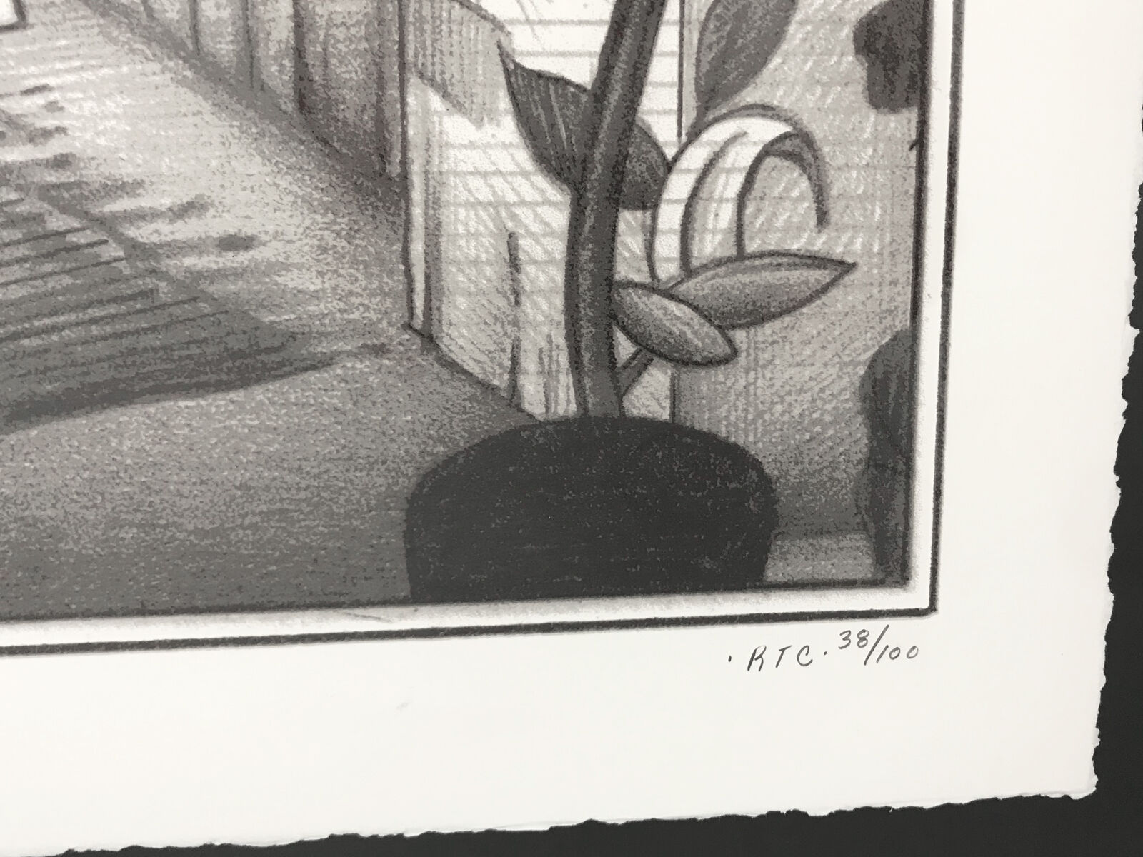 A black and white drawing of a man holding a sign with a snake on it.