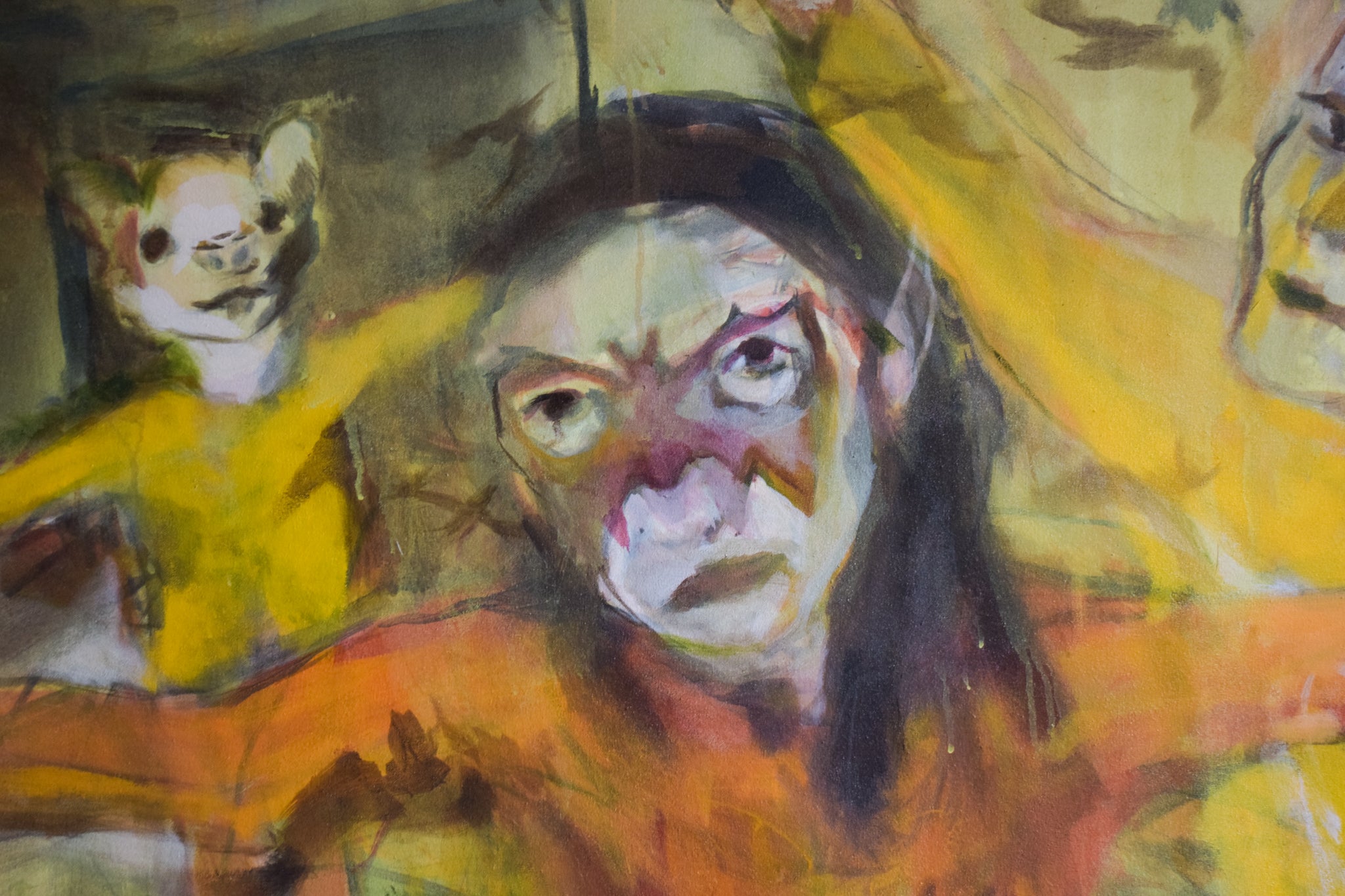 A painting of a woman holding a cat in her arms.