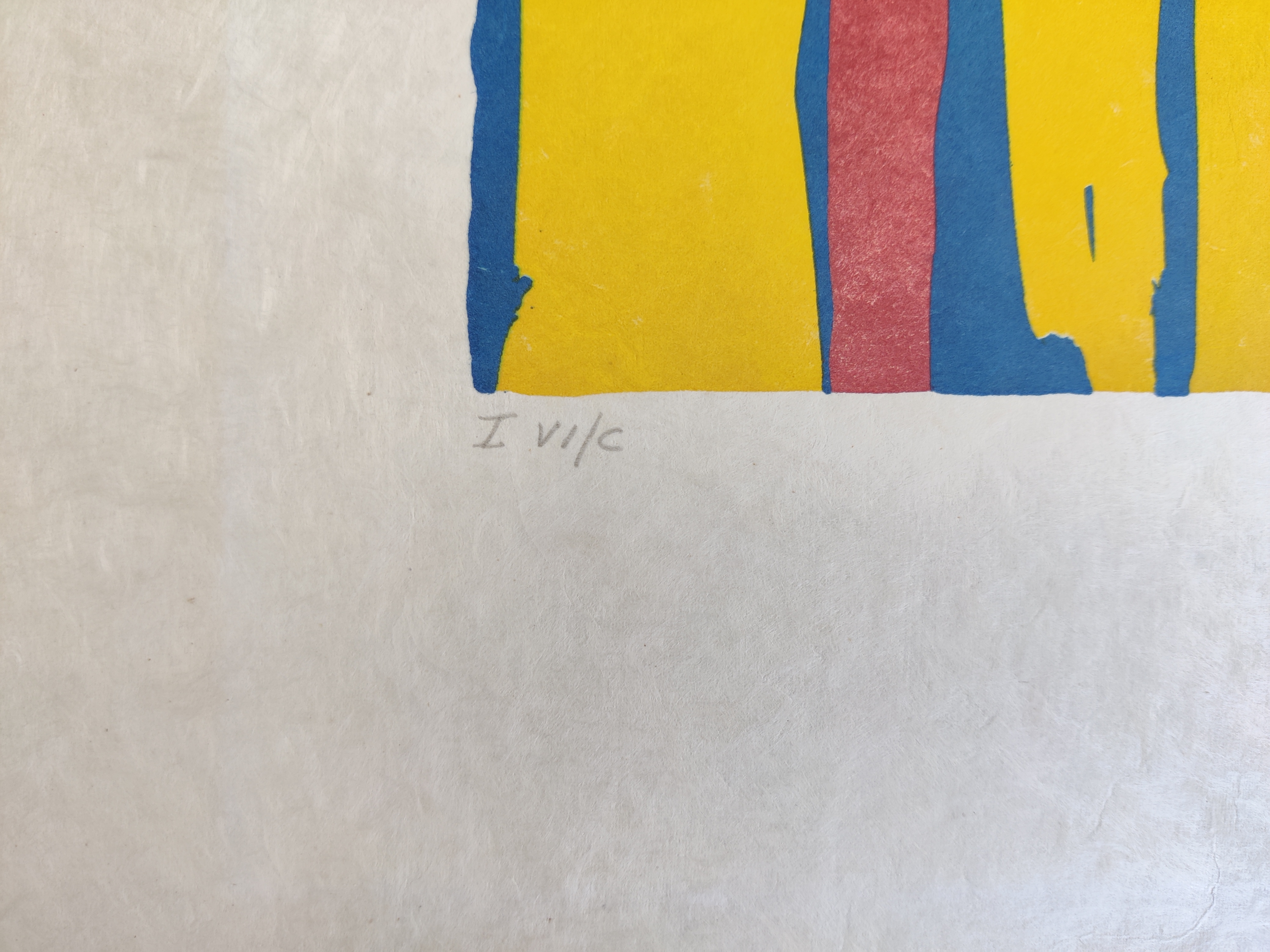A blue and yellow print with an angel flying over a bed.