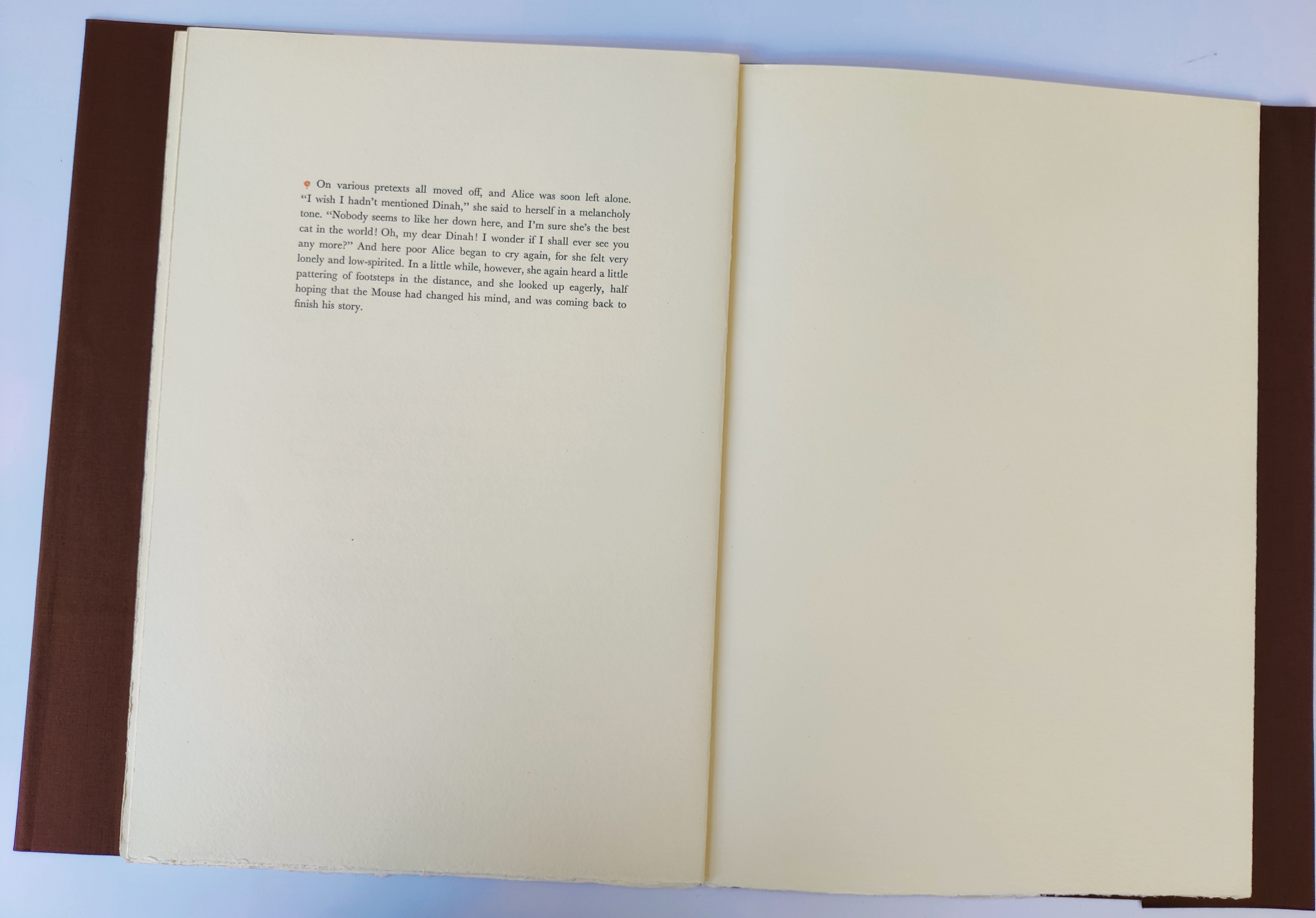 A painting of a cat sitting on top of a table.