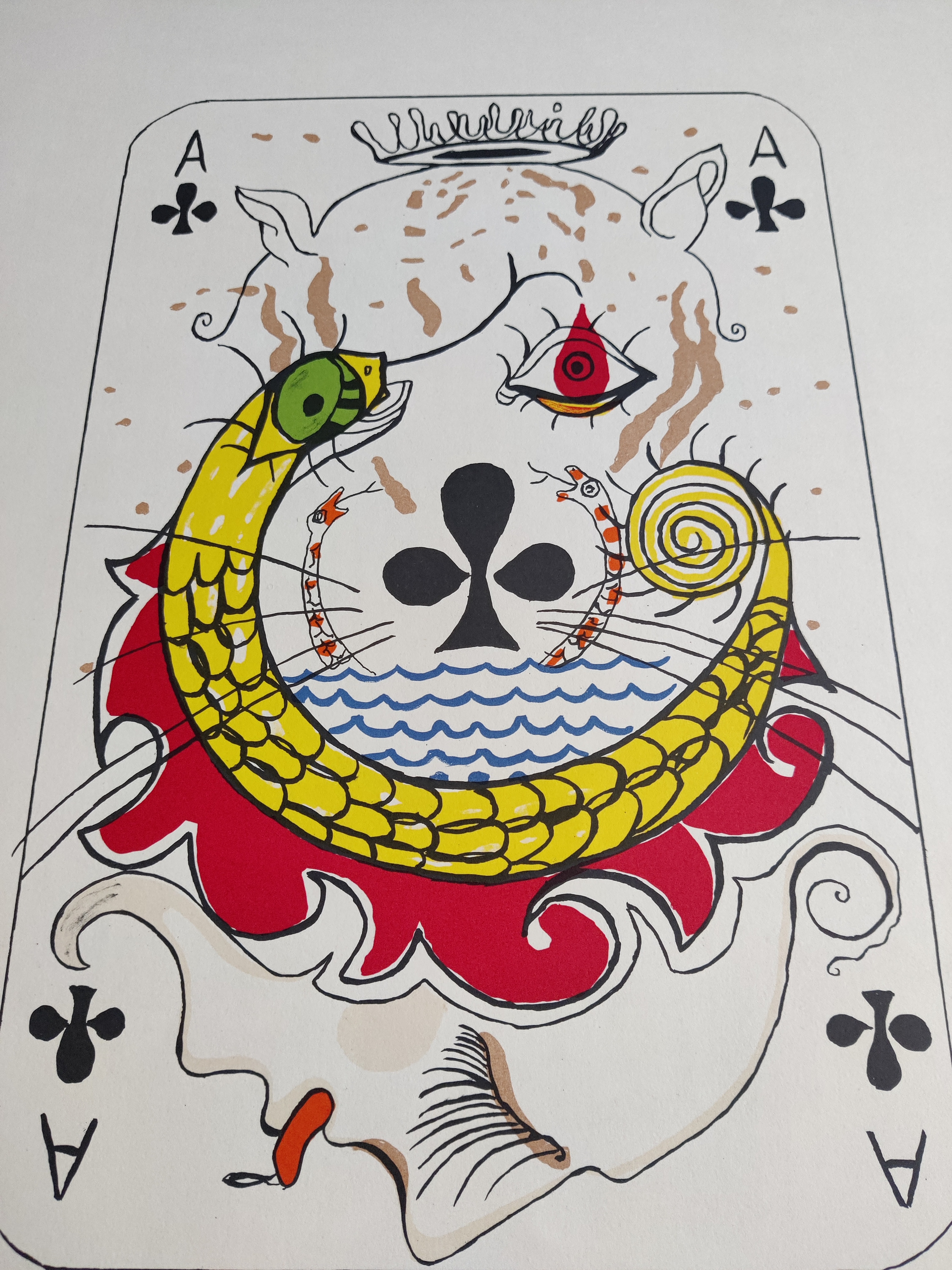 A stylized playing card featuring a surreal face with a coiled snake and floral elements.