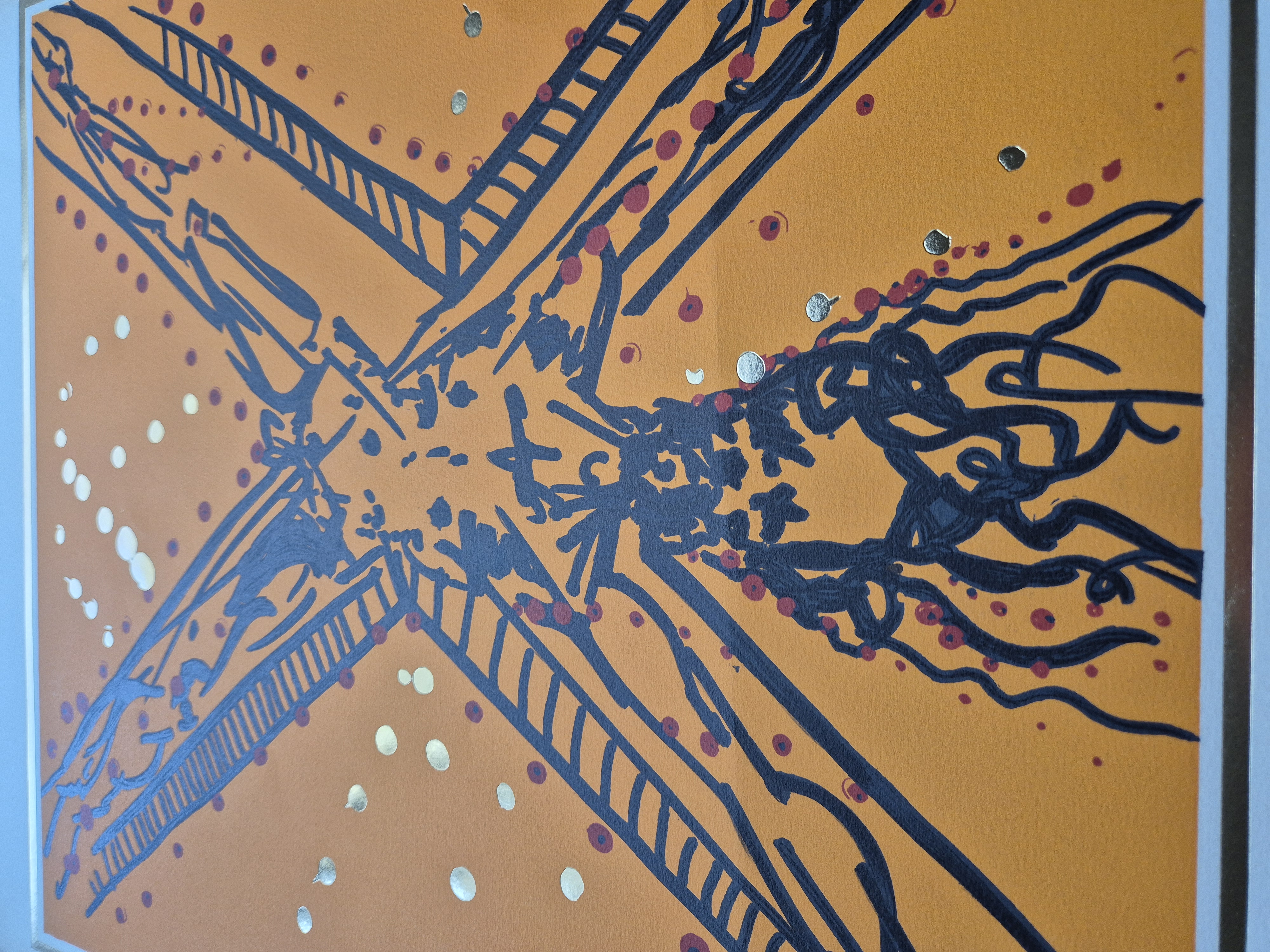 A painting of a windmill on an orange background. 