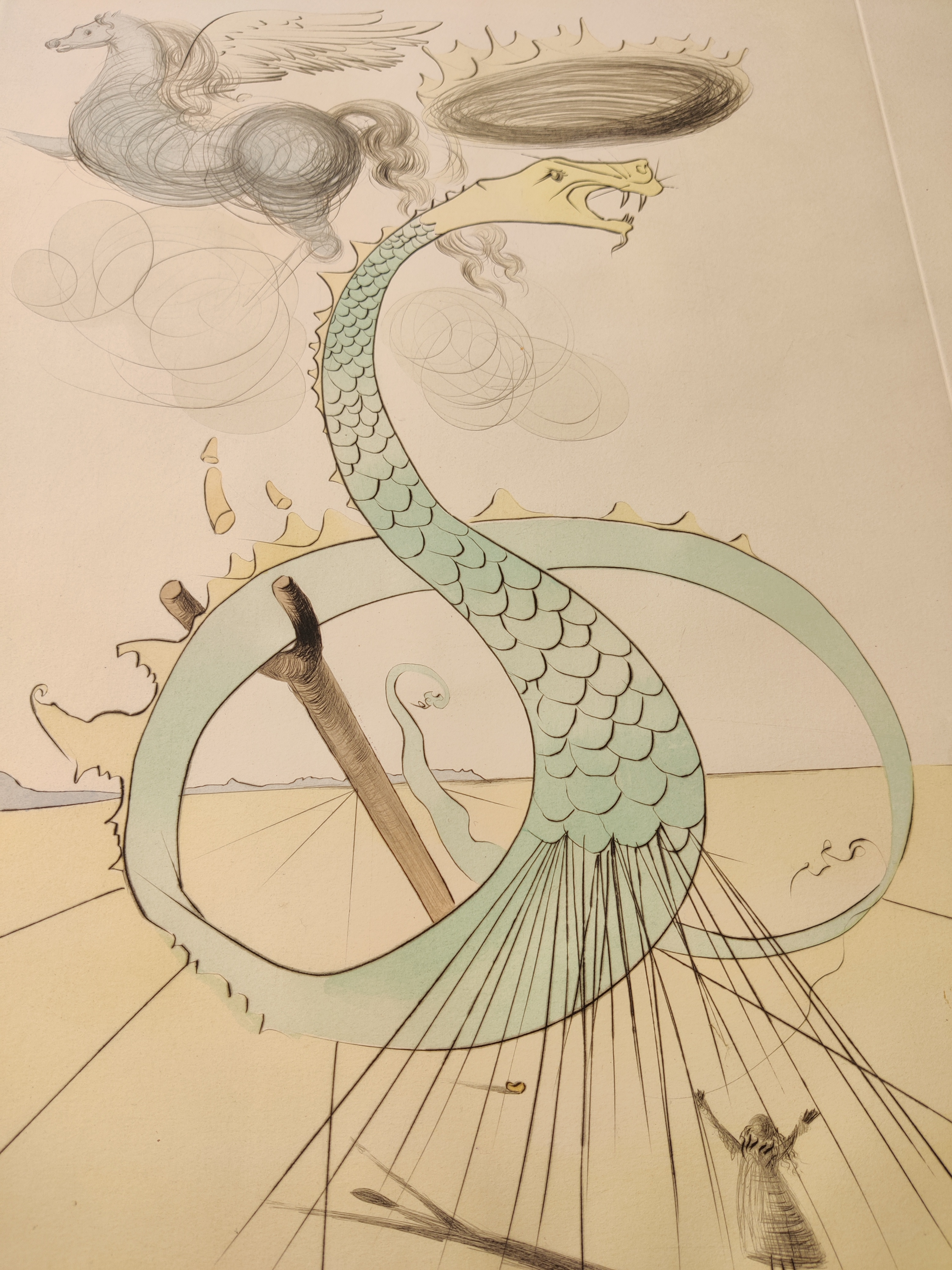 A drawing of a dragon with a man standing next to it.