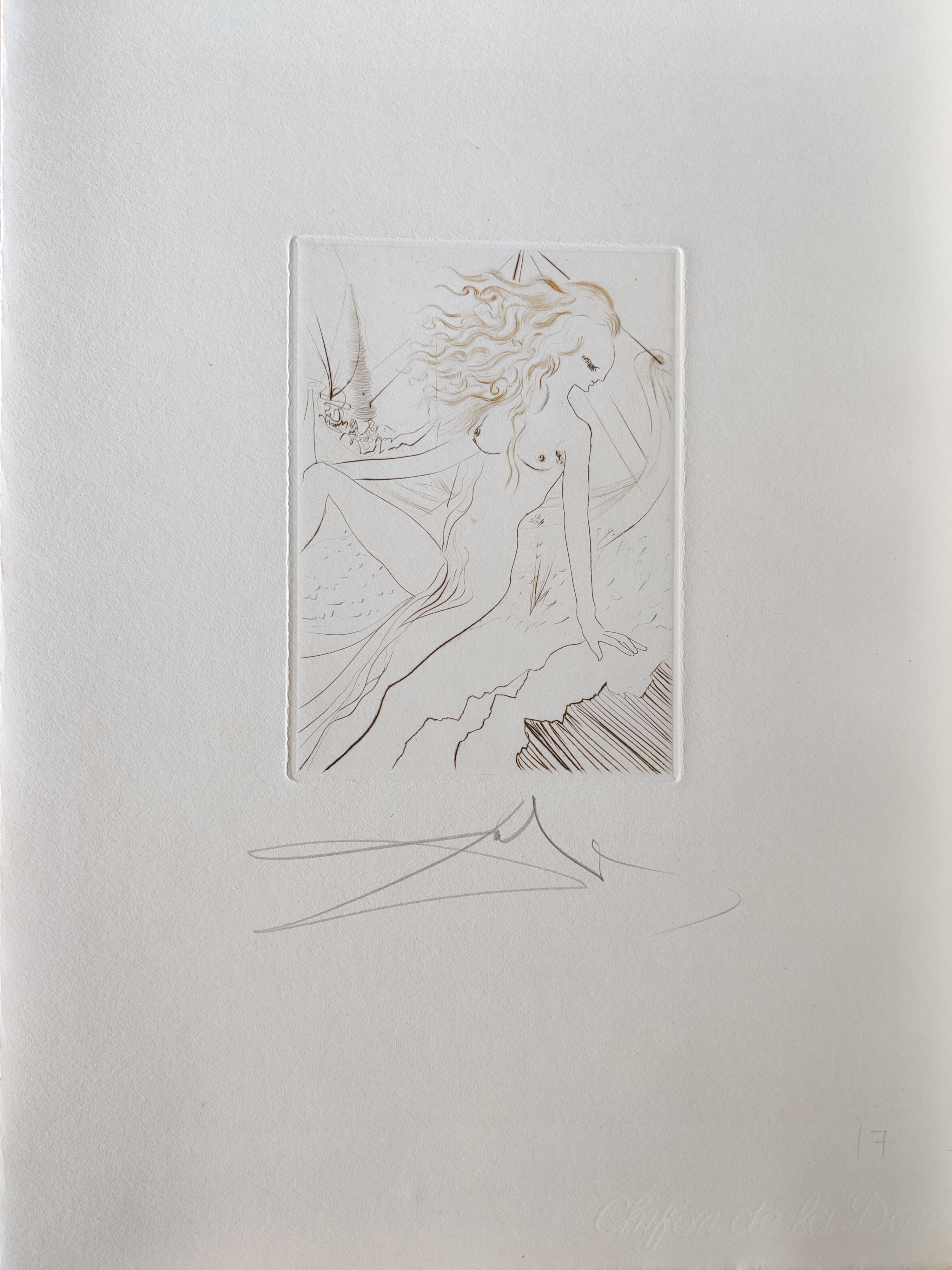 A series of drawings on a white wall. 