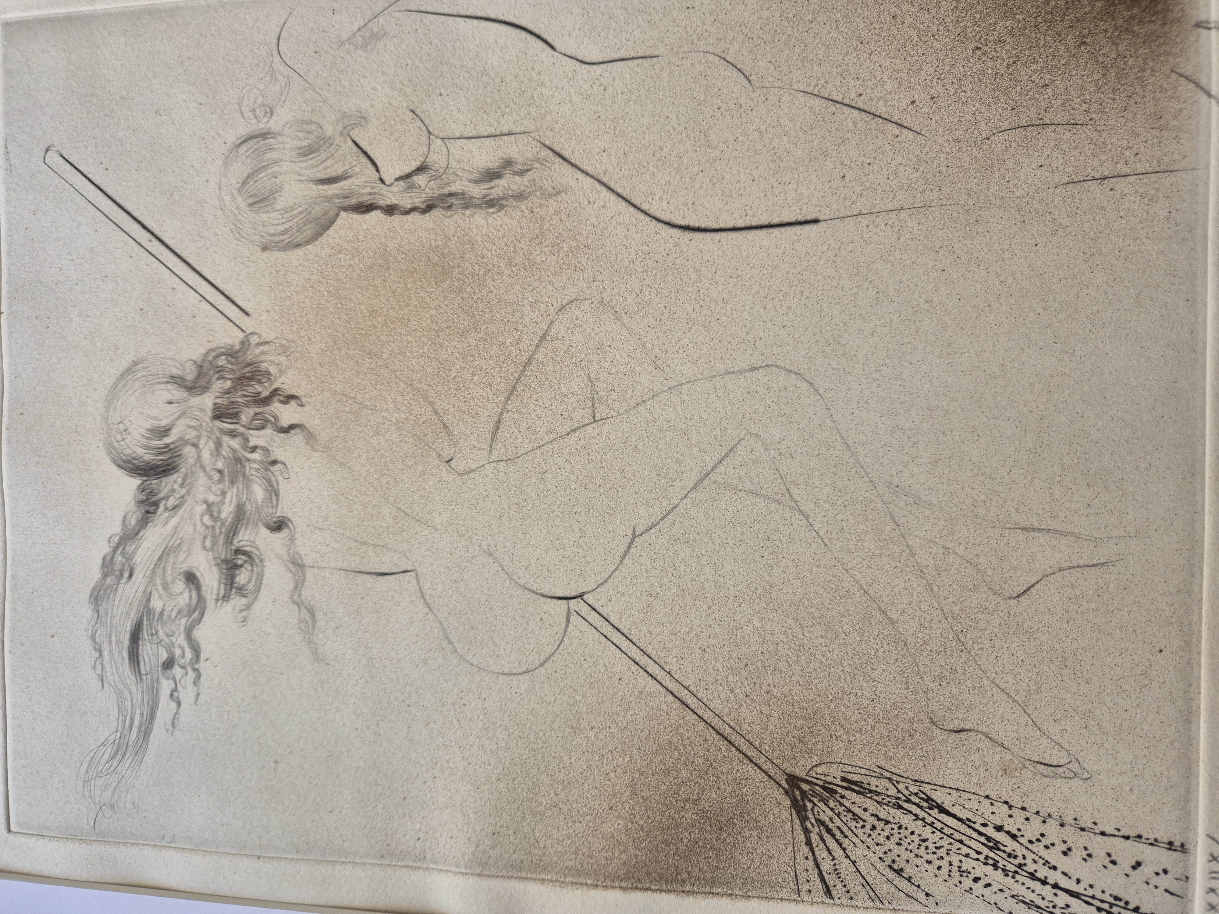 A framed charcoal drawing of two nude figures in a dynamic, sketchy style.