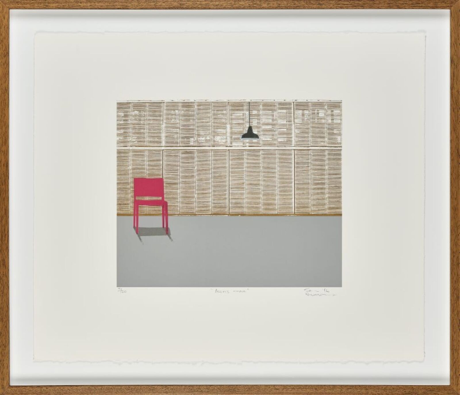 a red chair sitting in front of a wall