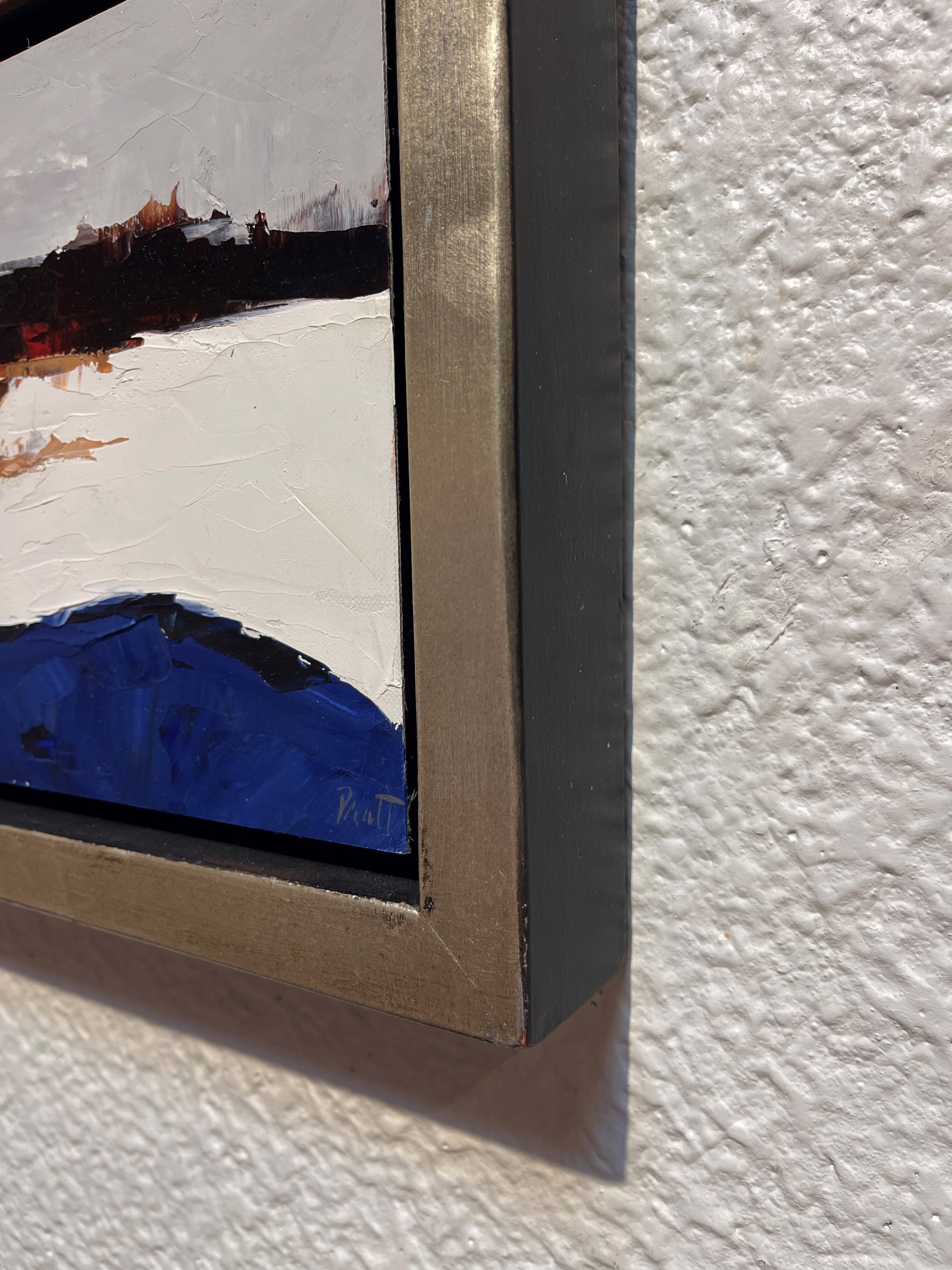 A painting of a landscape with a blue and brown color palette.