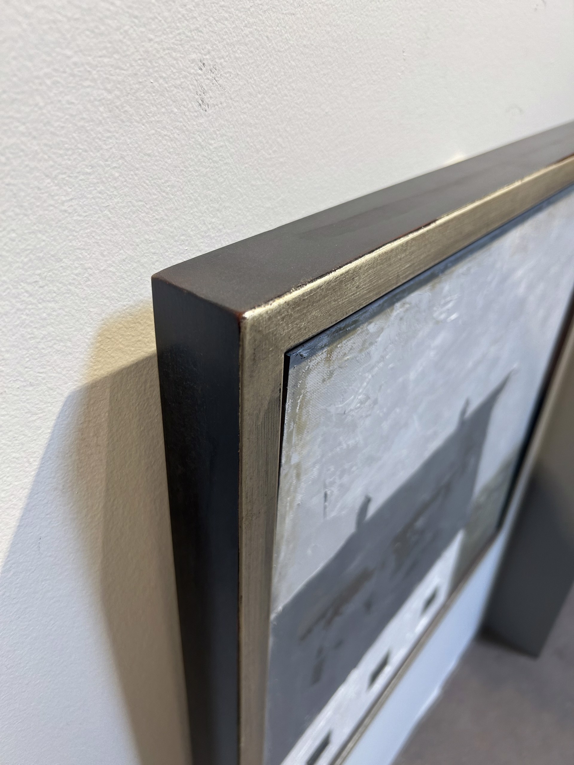 A painting of a white house with a black roof.