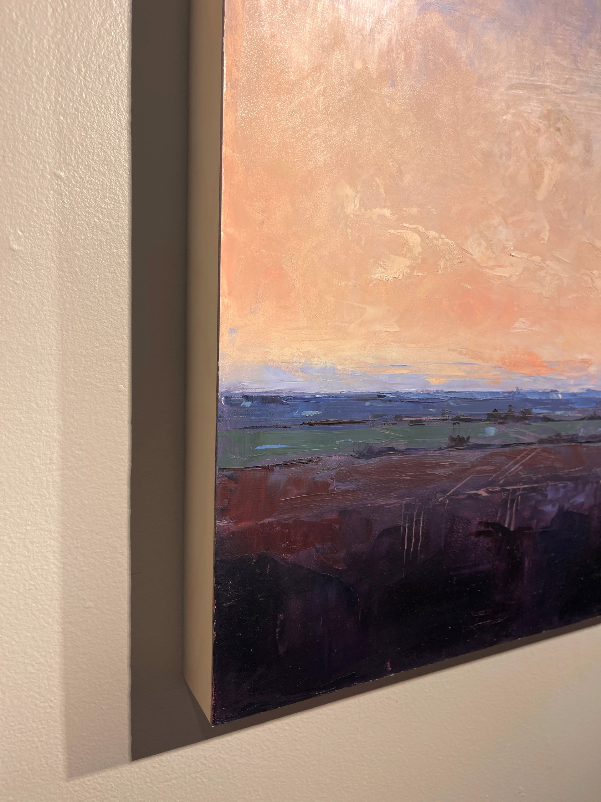 A painting of a sunset over a field. 