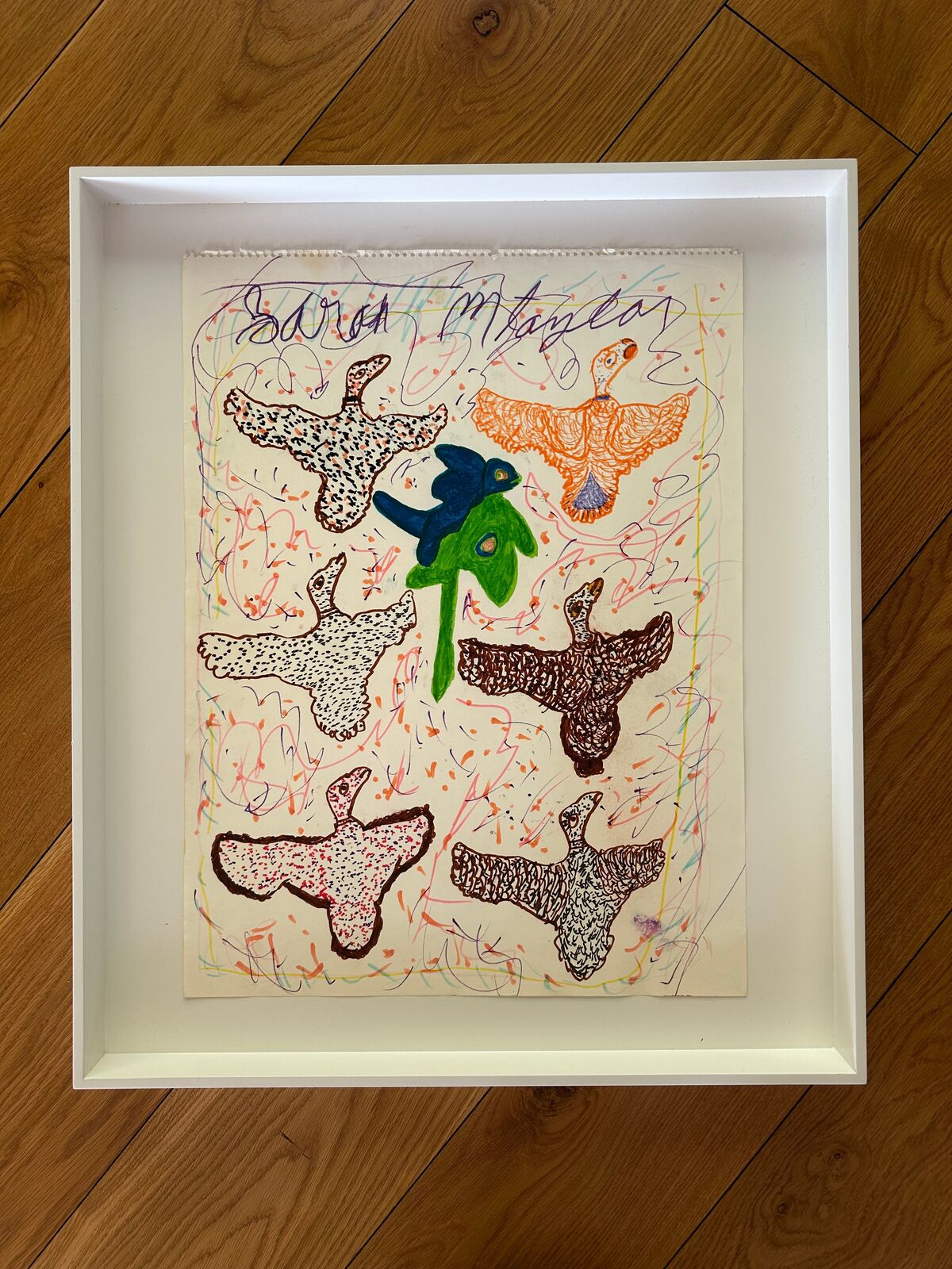 A drawing of a group of birds flying in the air.