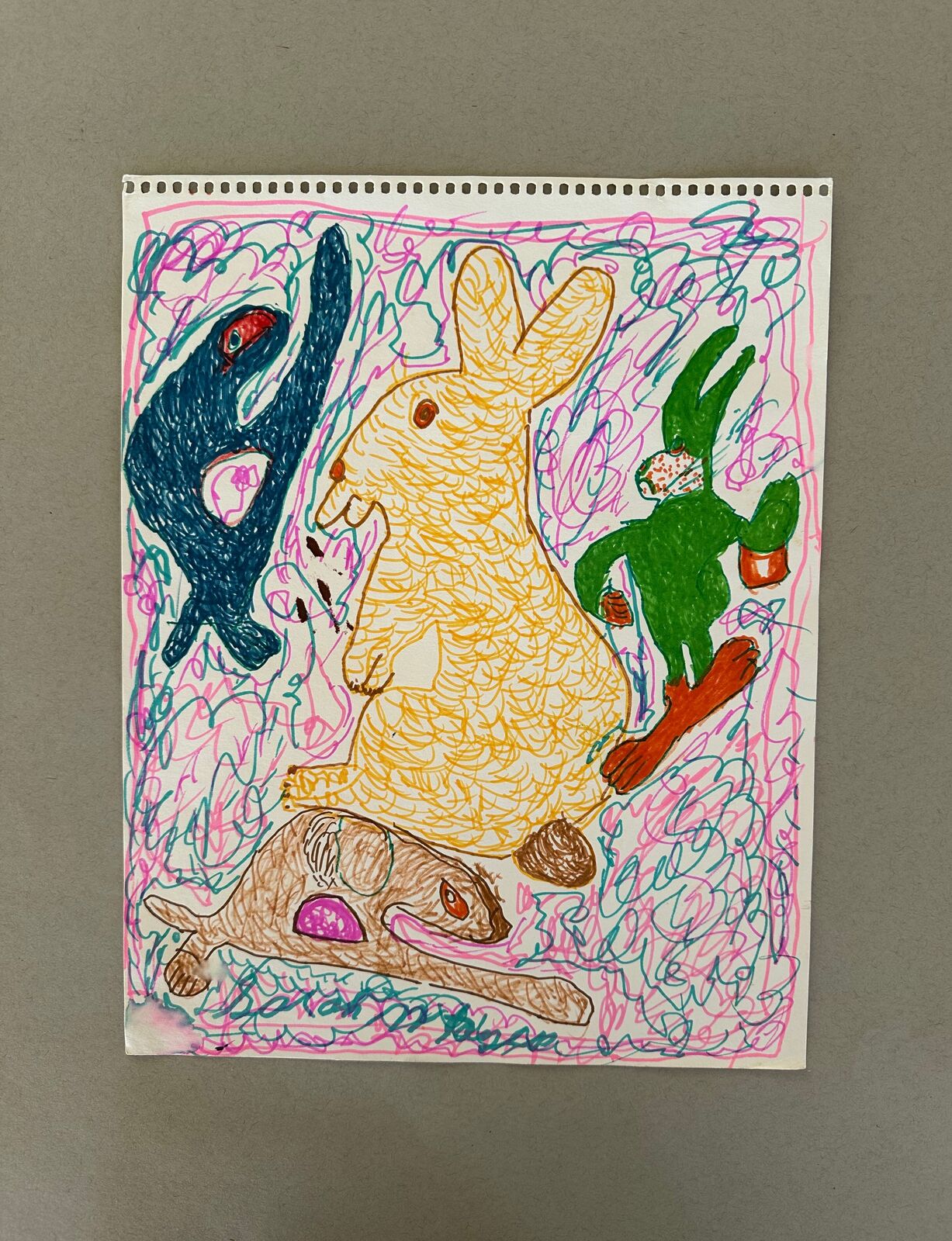 A drawing of a rabbit, a rabbit and a rabbit on a piece of paper.