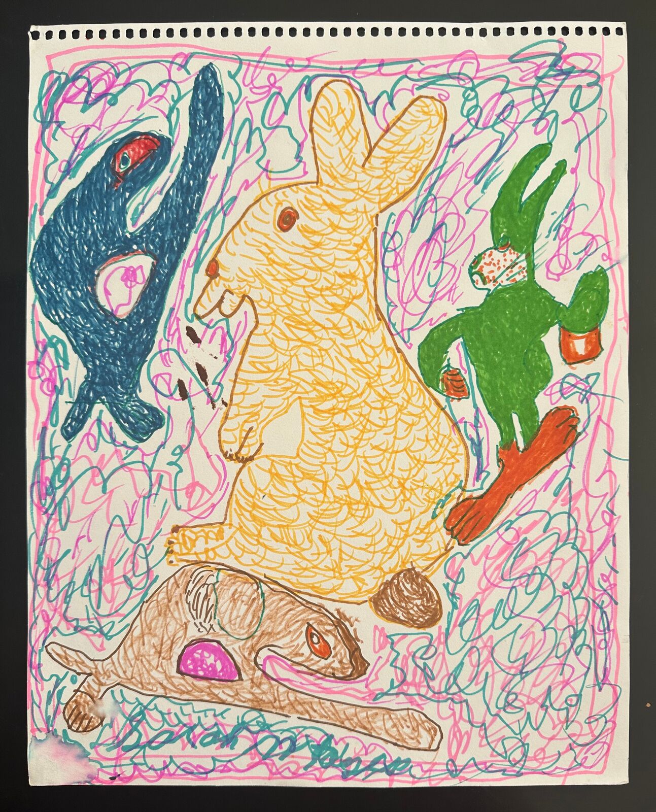 A drawing of a rabbit, a rabbit and a rabbit on a piece of paper.