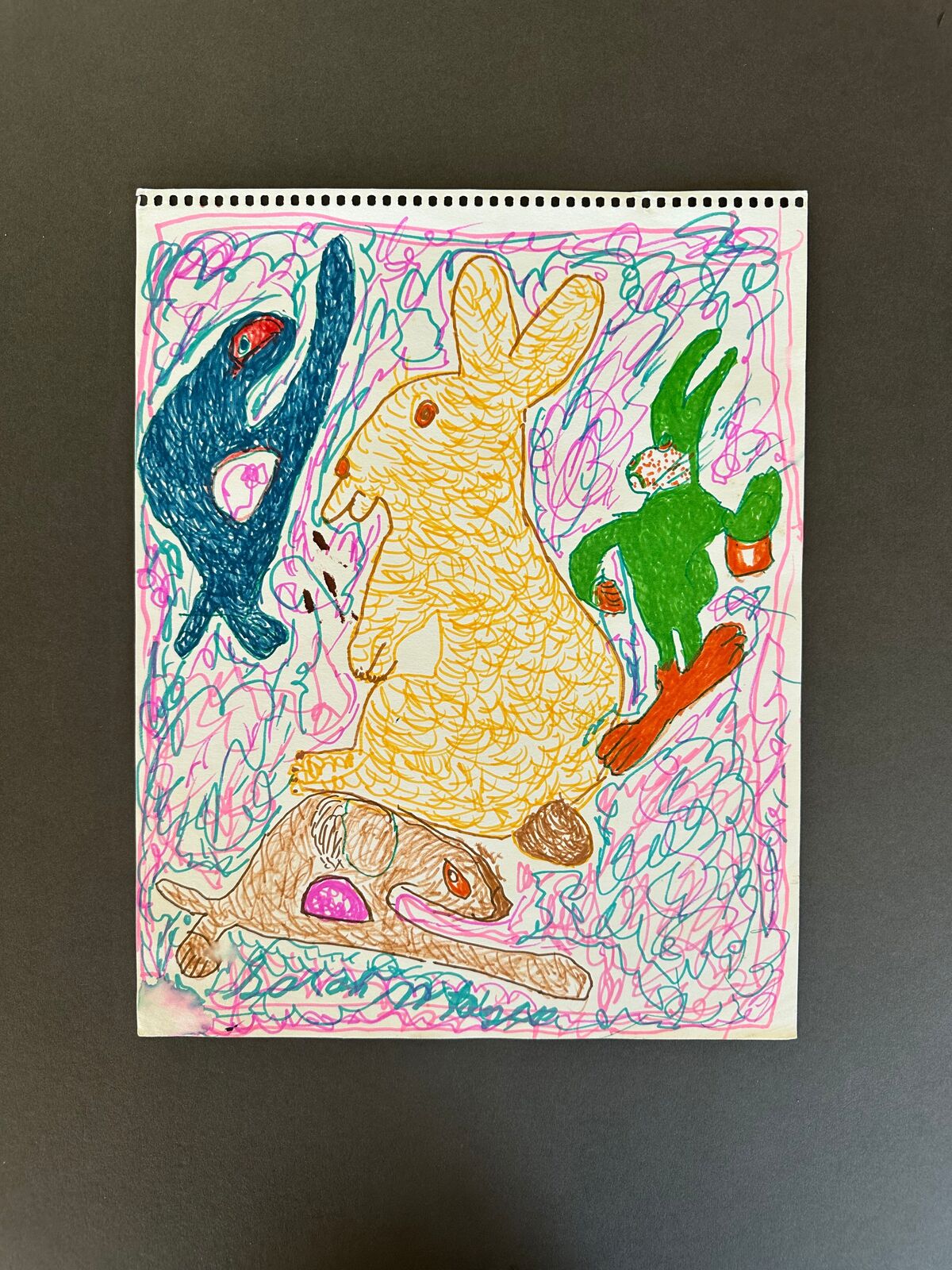 A drawing of a rabbit, a rabbit and a rabbit on a piece of paper.