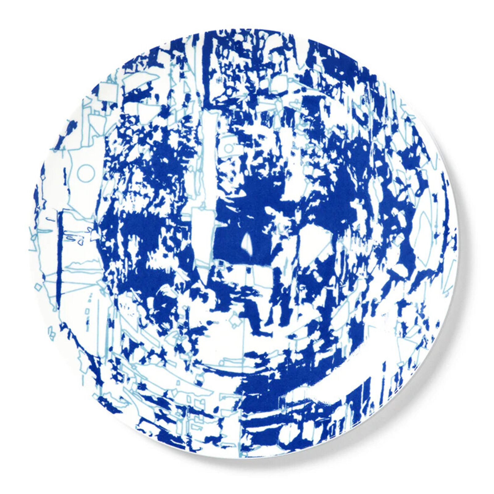 A blue and white plate with a pattern on it.