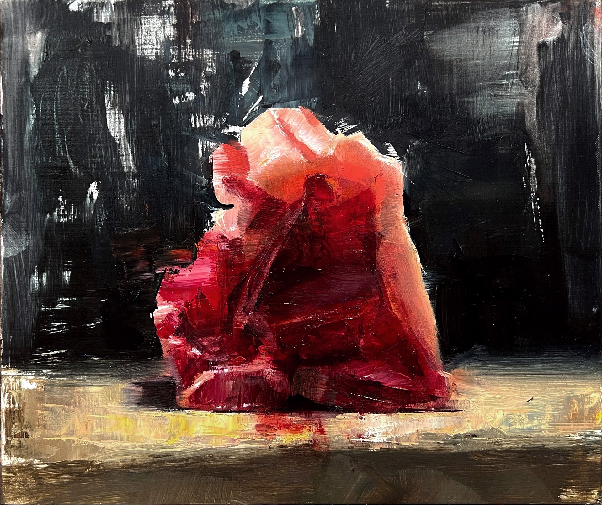 A painting of a red rock on a black background.