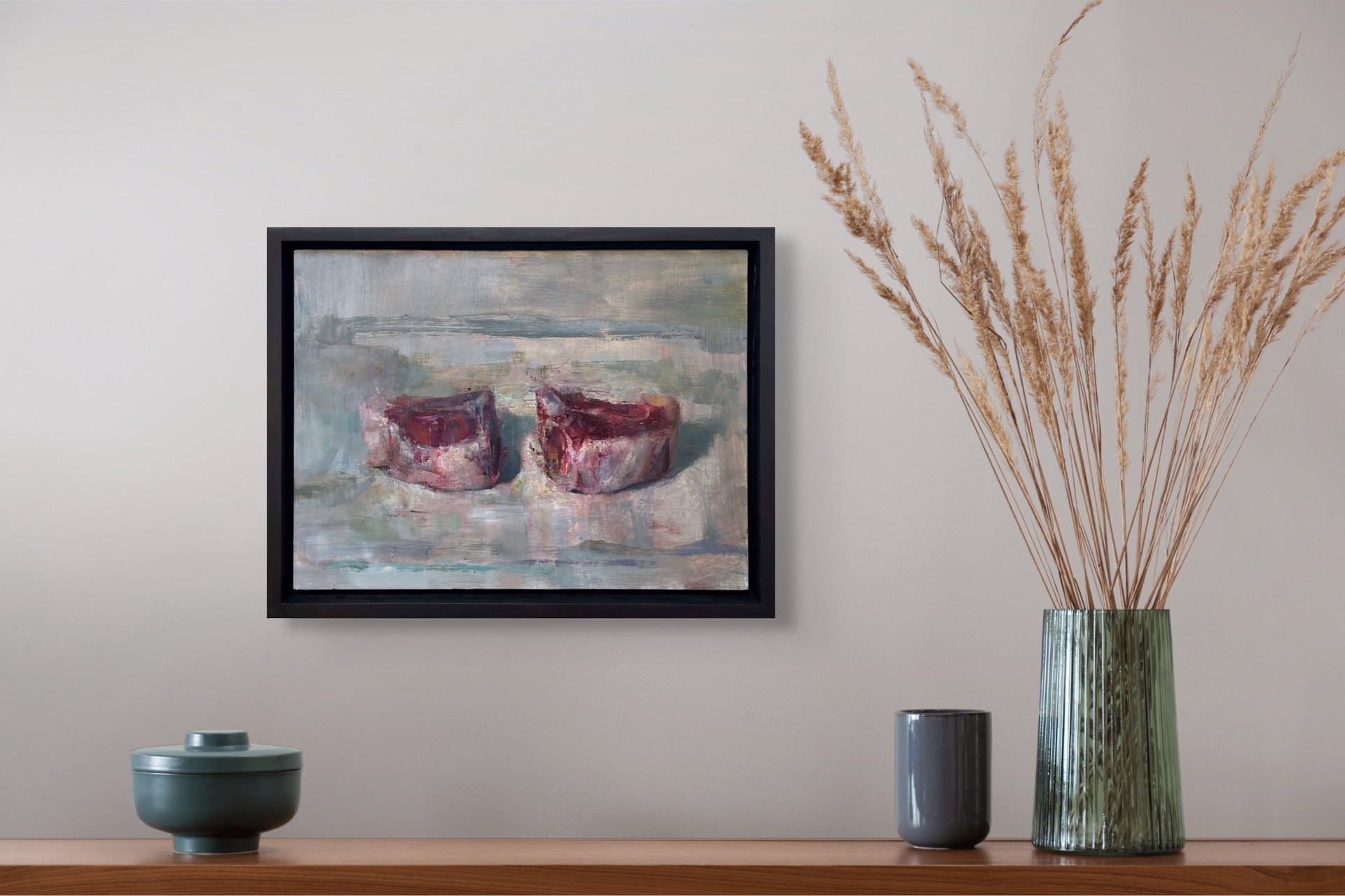 A painting of two red candles on a white surface.