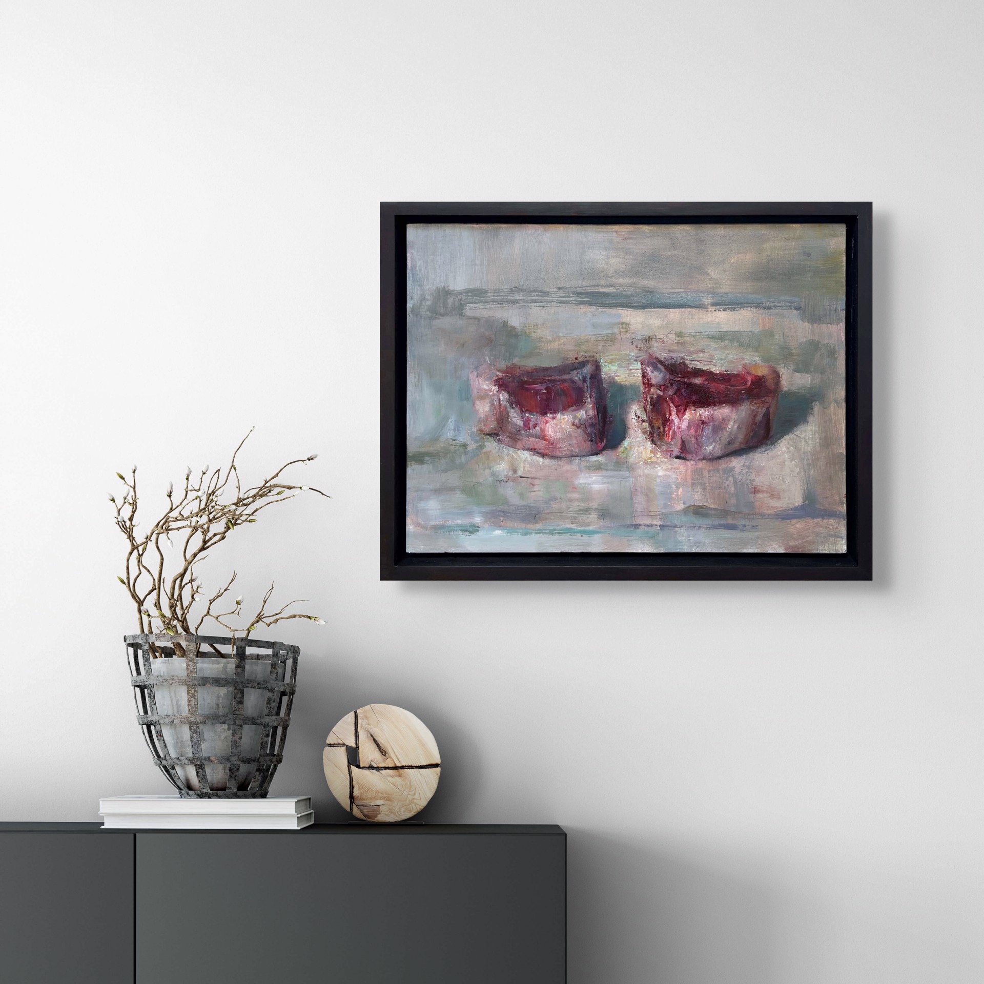 A painting of two red candles on a white surface.