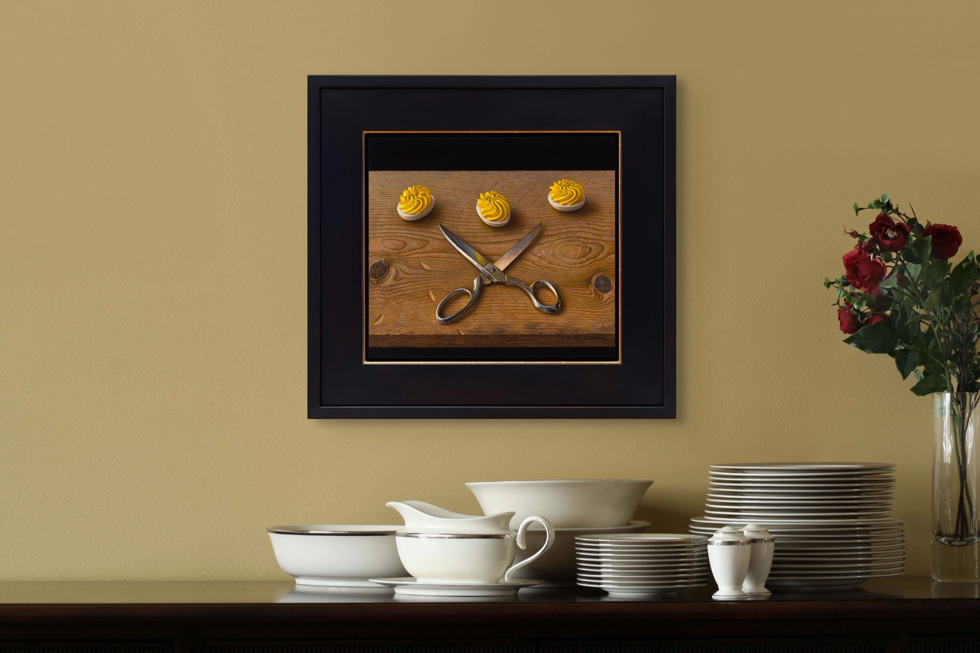 A still life painting featuring crossed silver scissors and three white discs topped with yellow frosting on a wooden surface.