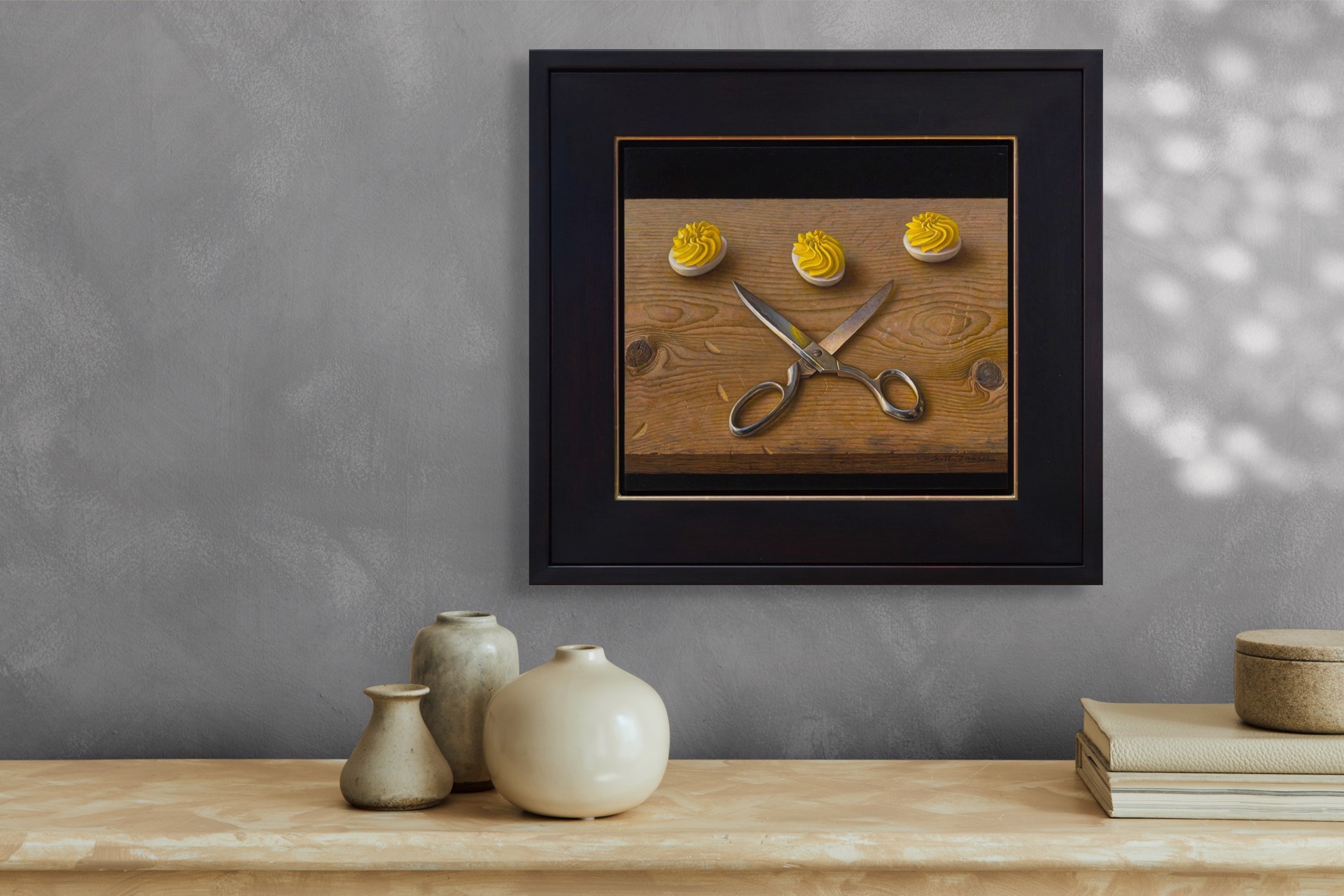 A still life painting featuring crossed silver scissors and three white discs topped with yellow frosting on a wooden surface.
