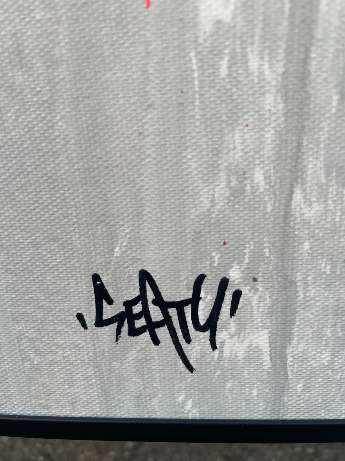 A portrait of a figure with a vibrant, graffiti-style explosion of colorful symbols and text erupting from their head.