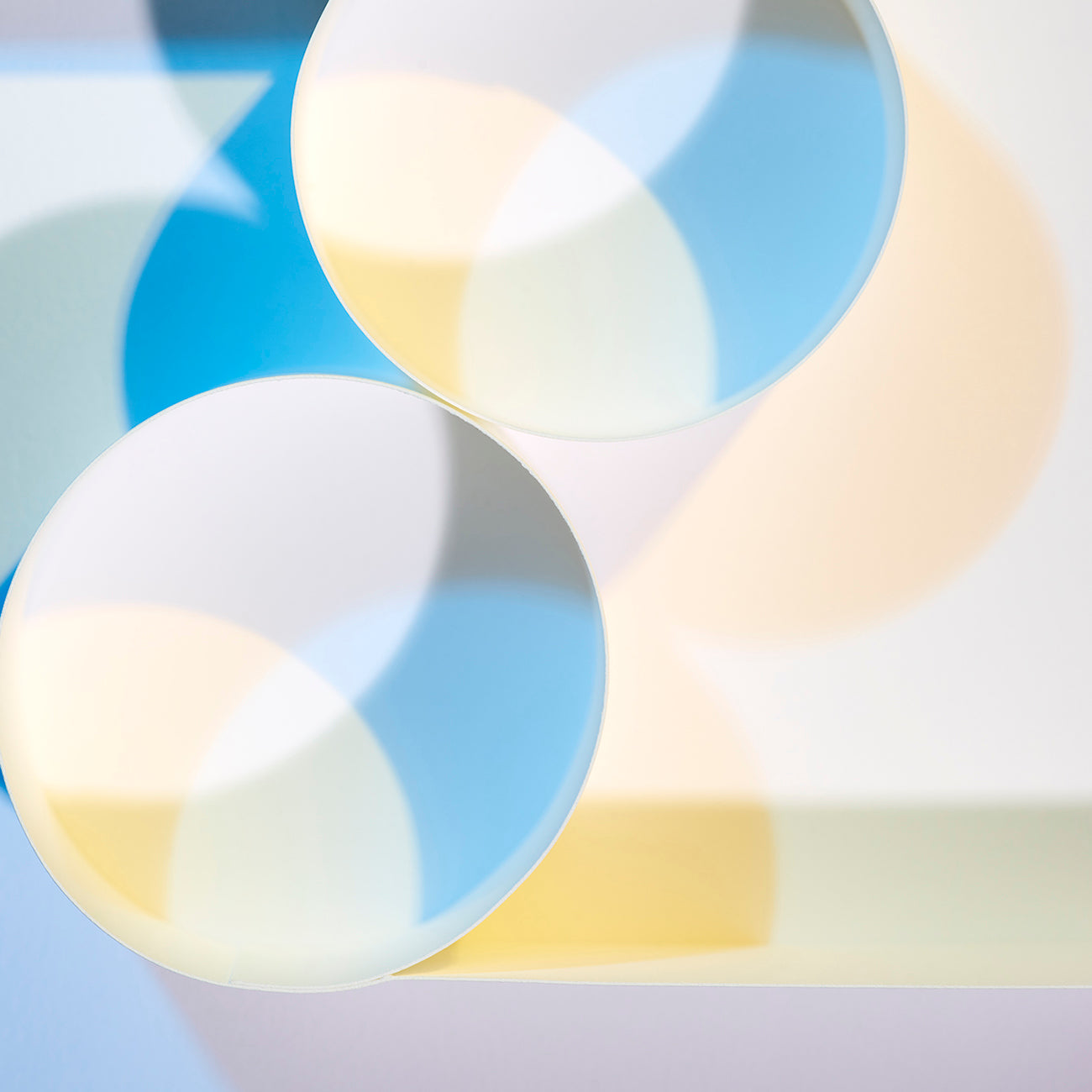 A picture of three circles on a white surface. 