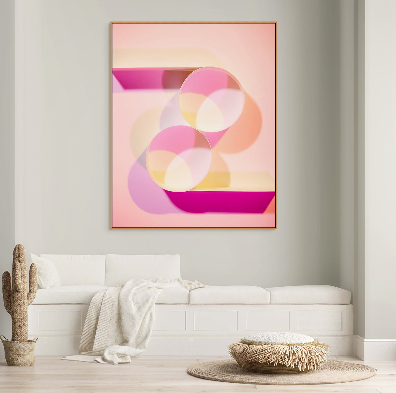 A pink and yellow abstract painting with circles on a pink background.