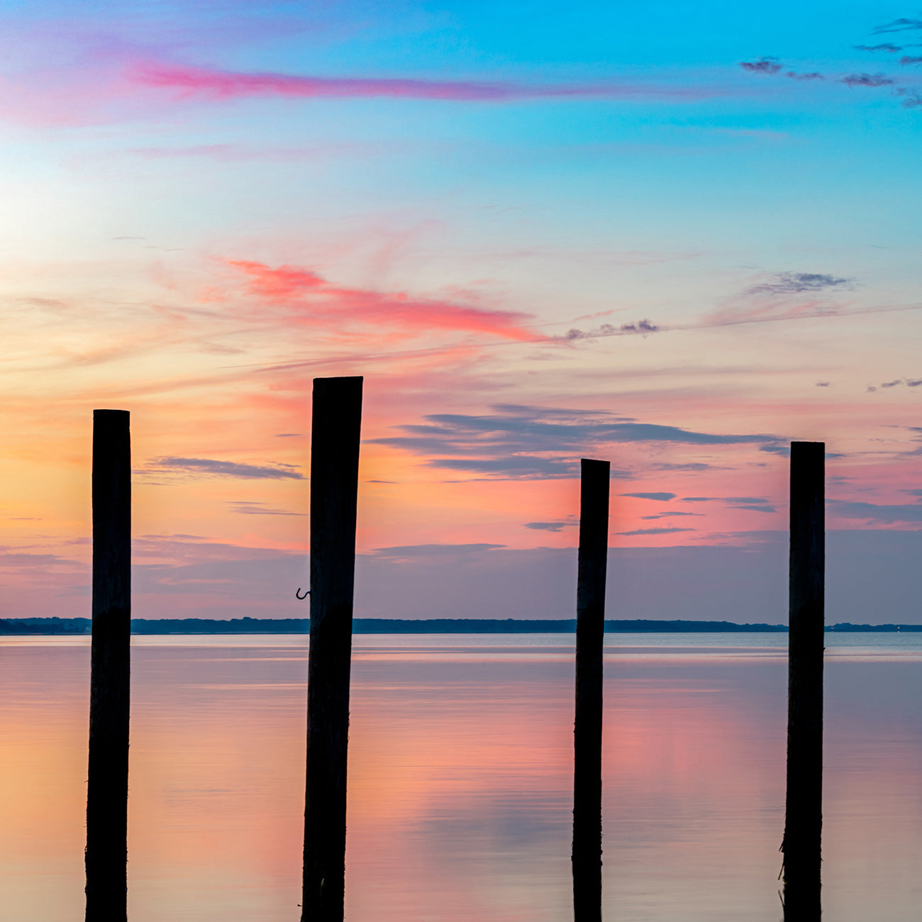 A couple of pictures of a sunset over a body of water.