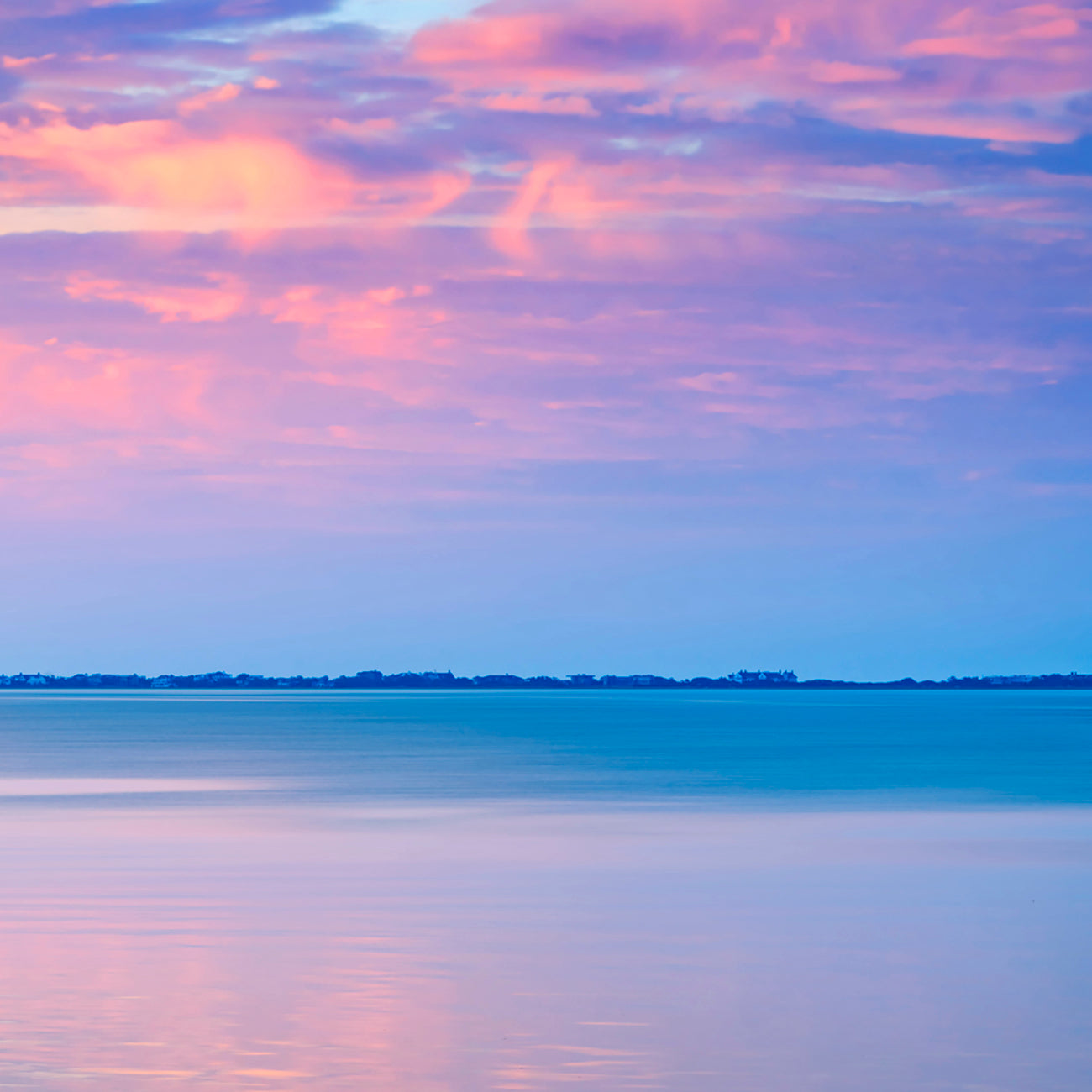 A set of three pictures of a sunset over the ocean.