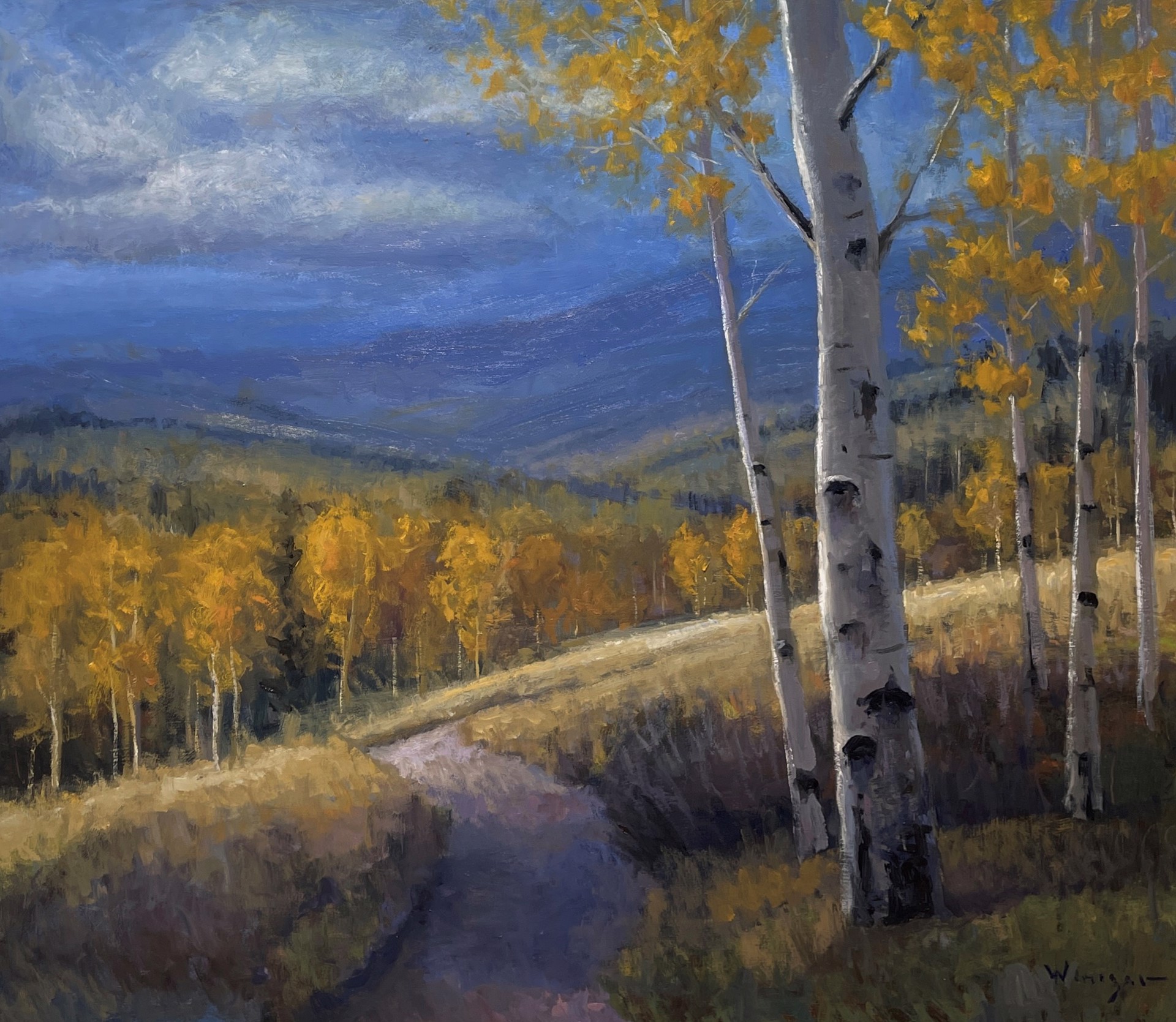 A serene autumn landscape featuring a winding path through golden aspen trees under a dramatic blue sky.