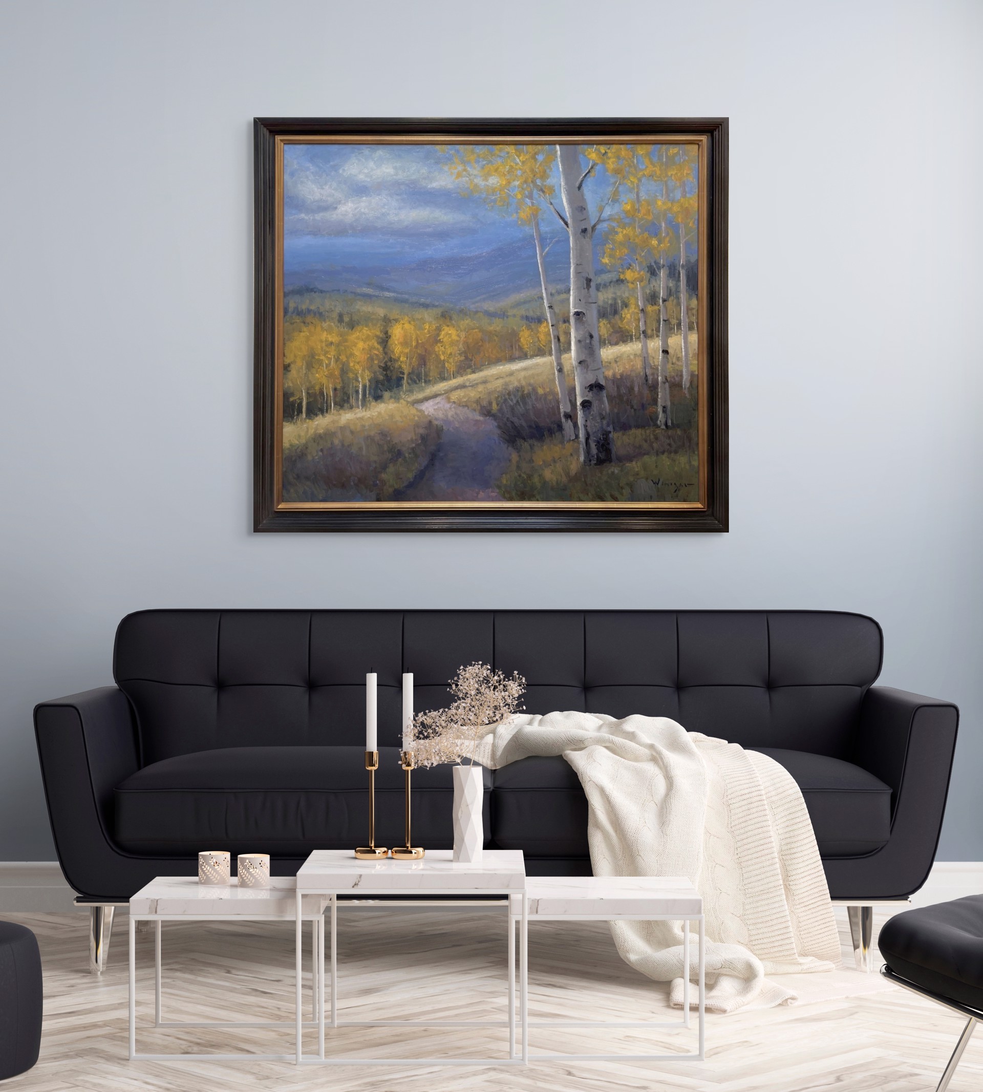 A serene autumn landscape featuring a winding path through golden aspen trees under a dramatic blue sky.