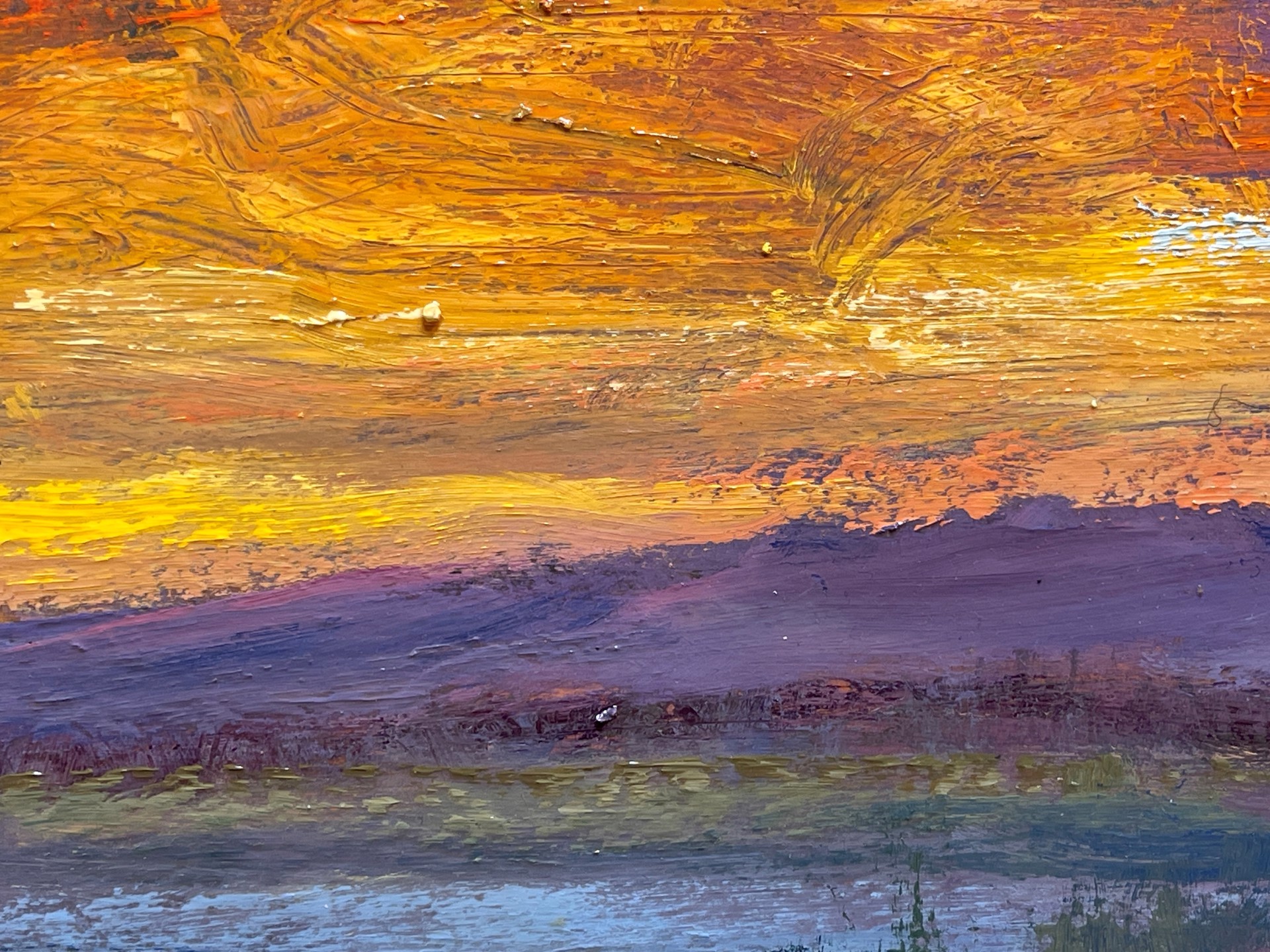 A painting of a sunset over a body of water.