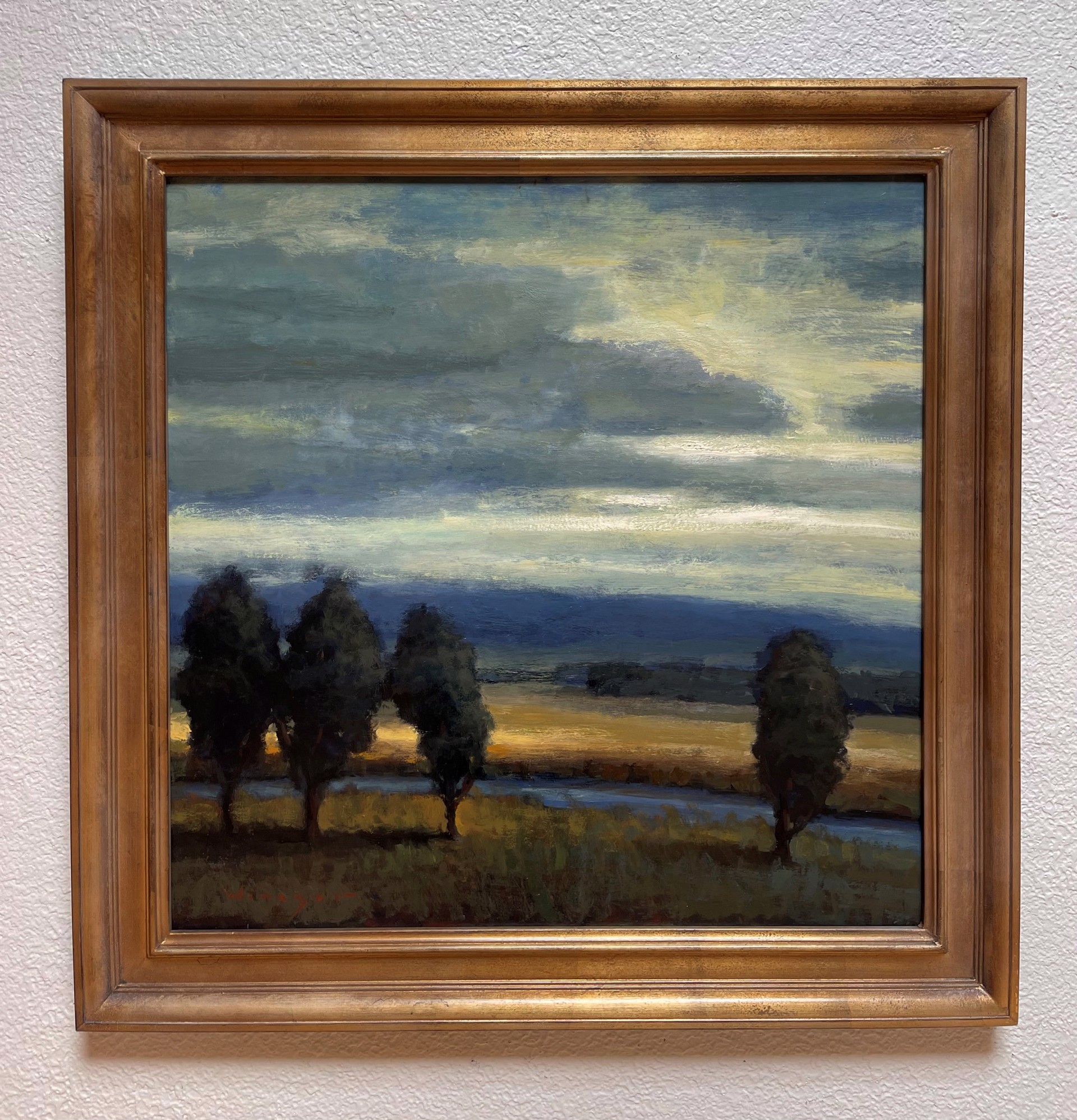 A painting of three trees in a field at sunset.