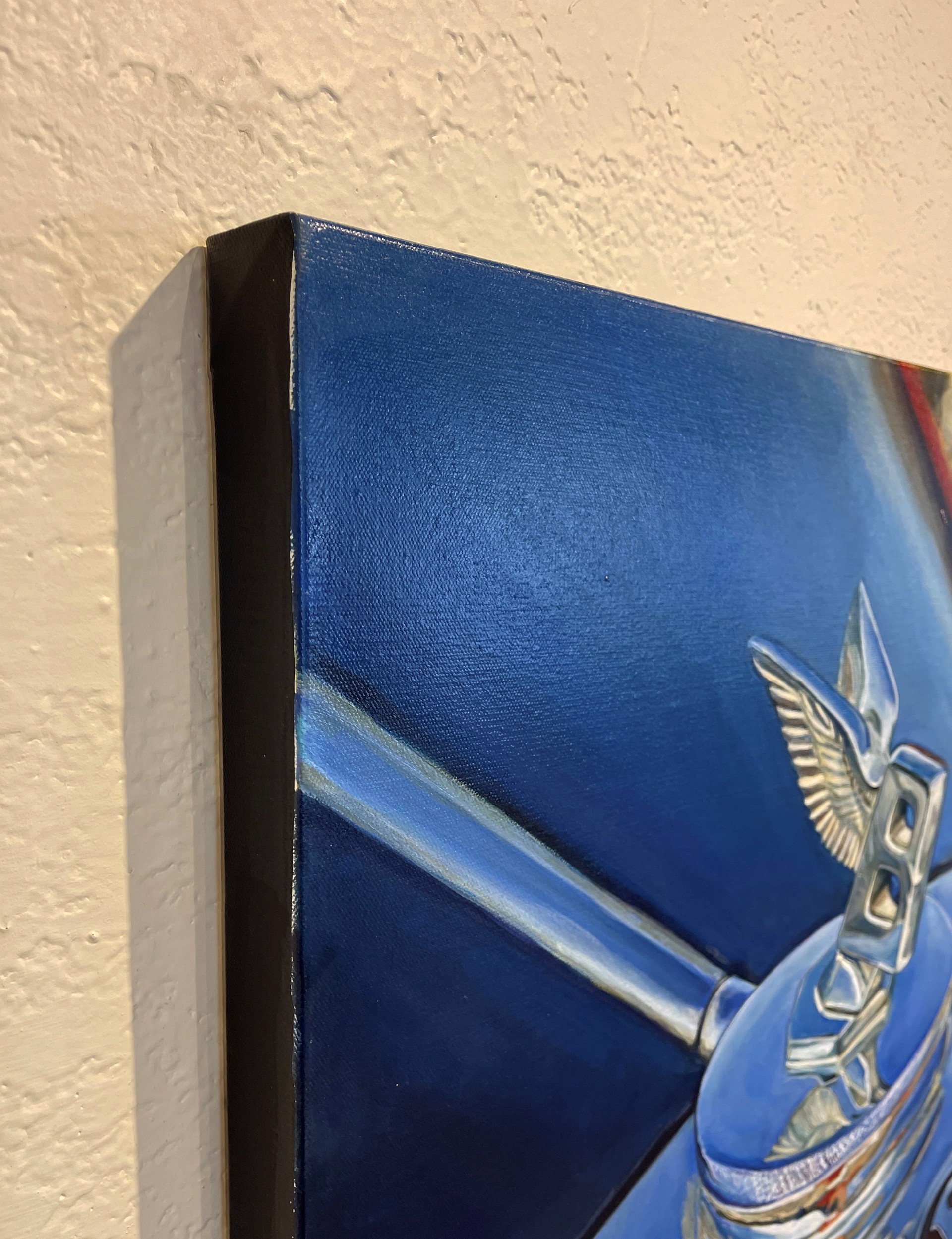A painting of a blue car with a bentley logo on it.
