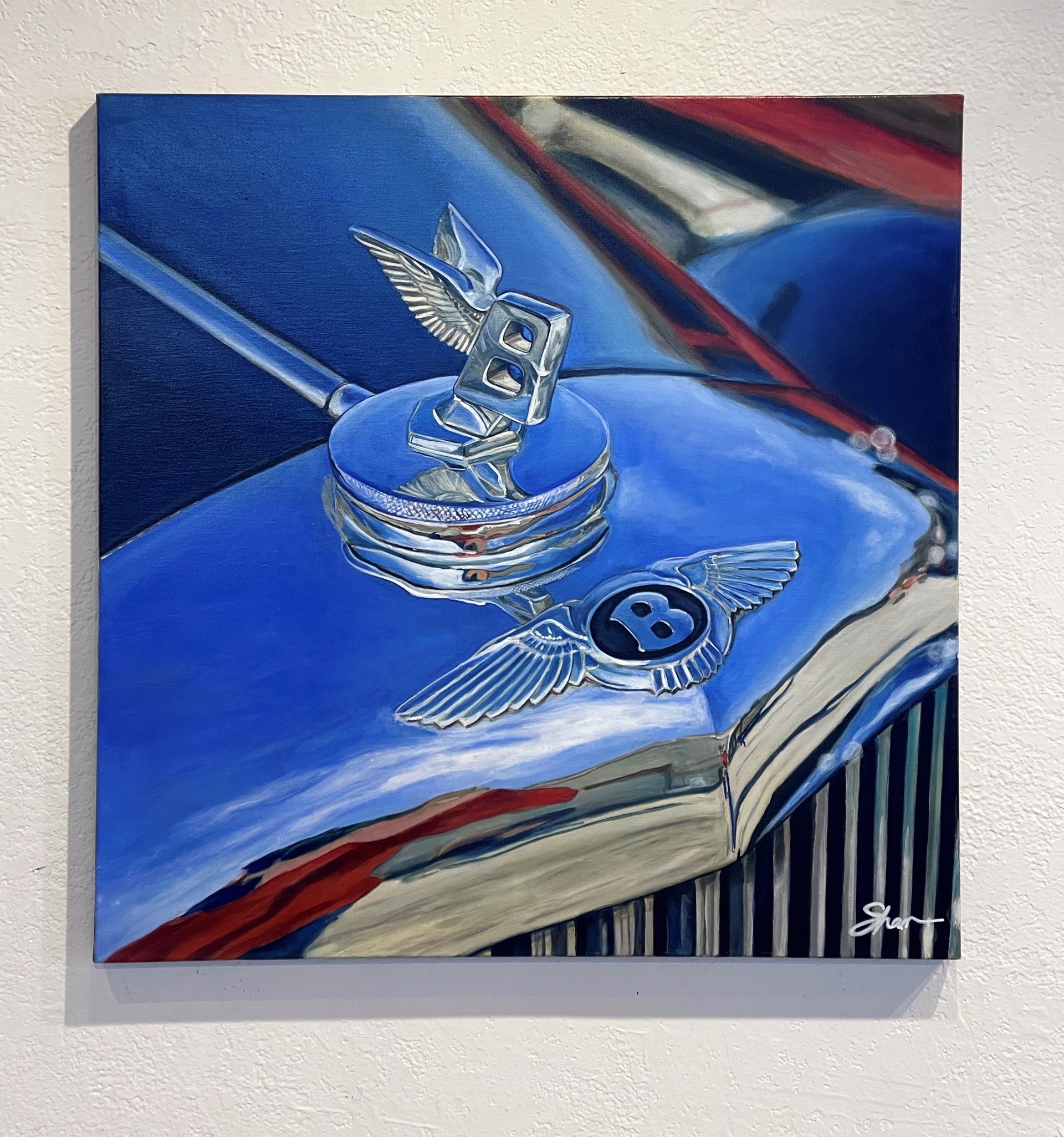 A painting of a blue car with a bentley logo on it.