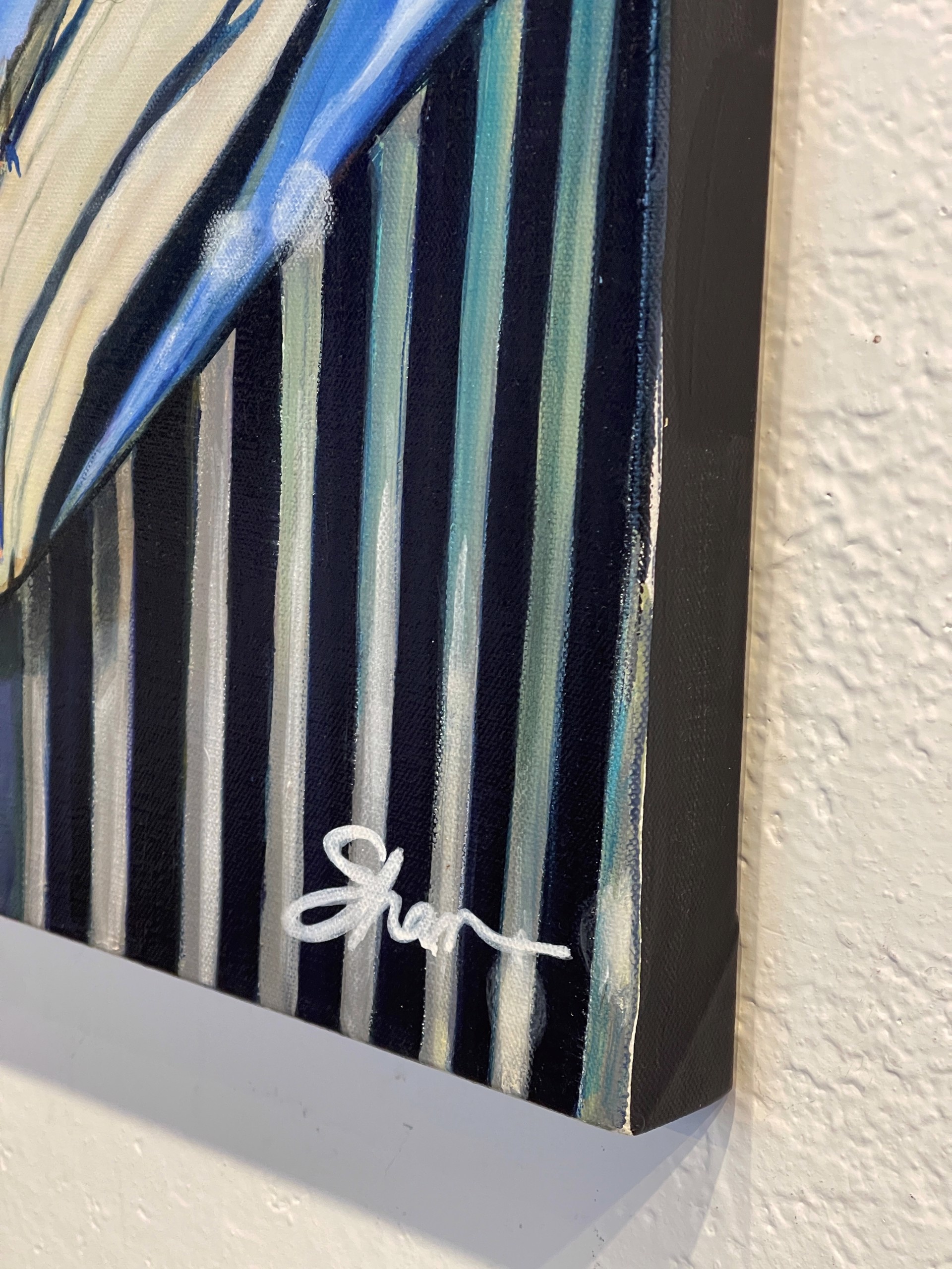 A painting of a blue car with a bentley logo on it.