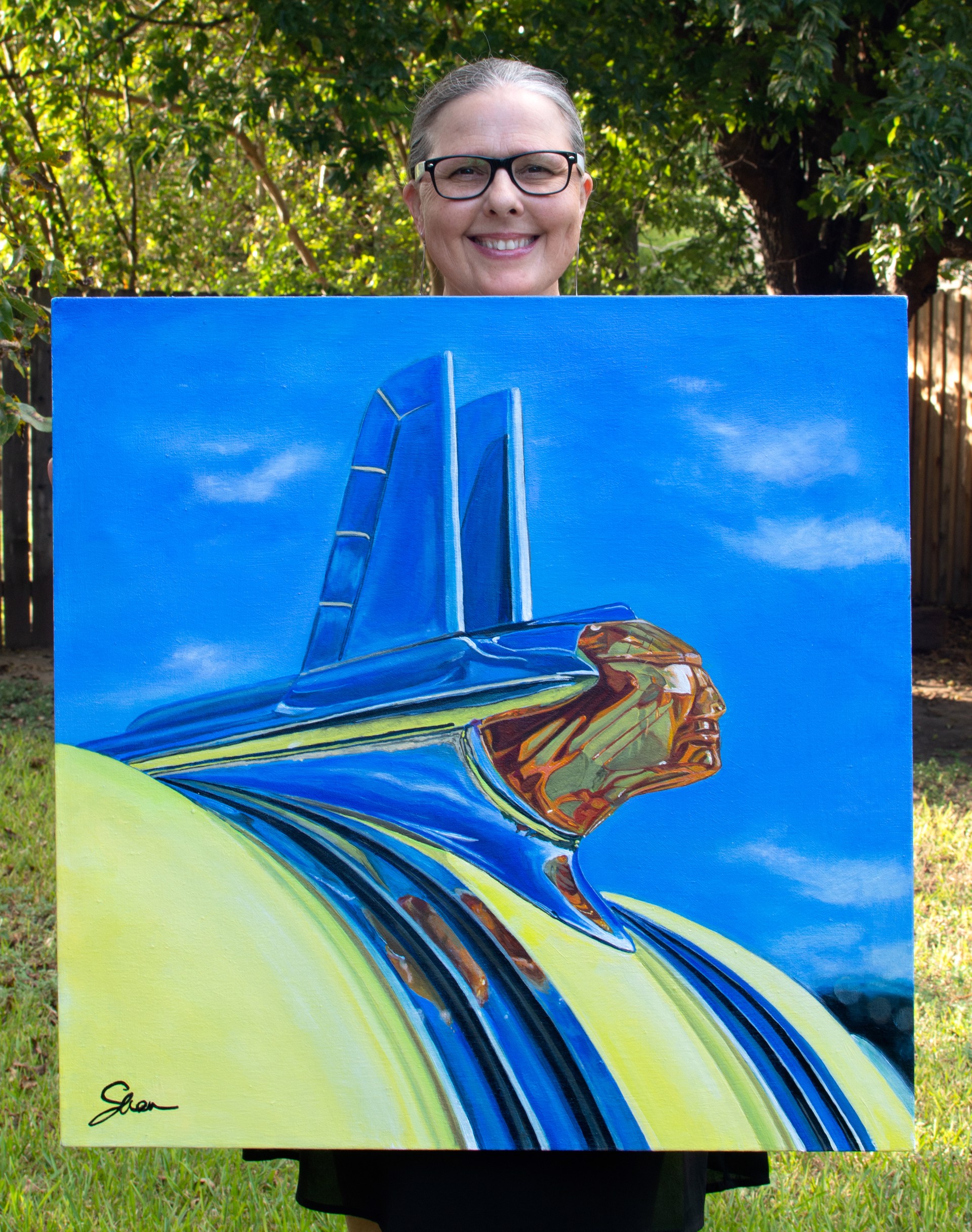 A painting of a yellow and blue car with a blue sky in the background.