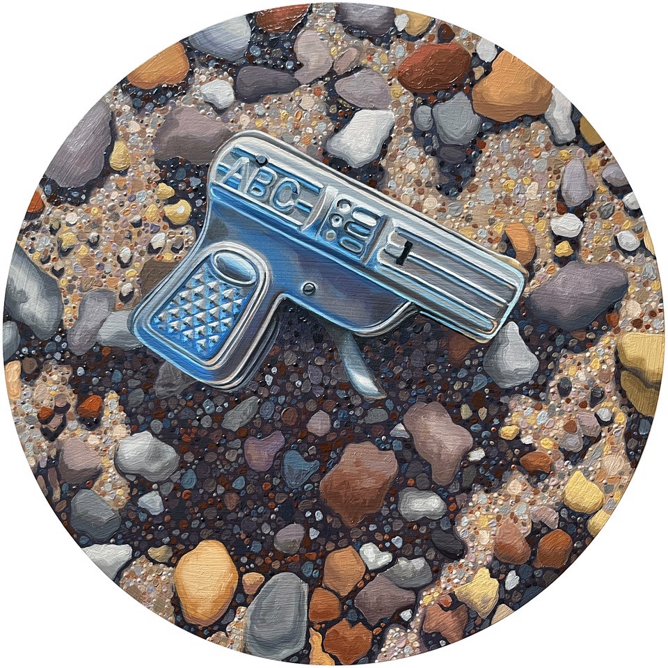 A painting of a toy gun on a pebble beach.