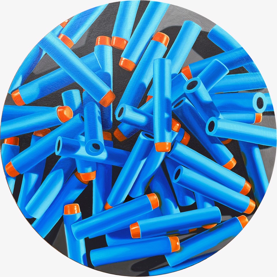 A circle of blue and orange plastic bullets on a white background.