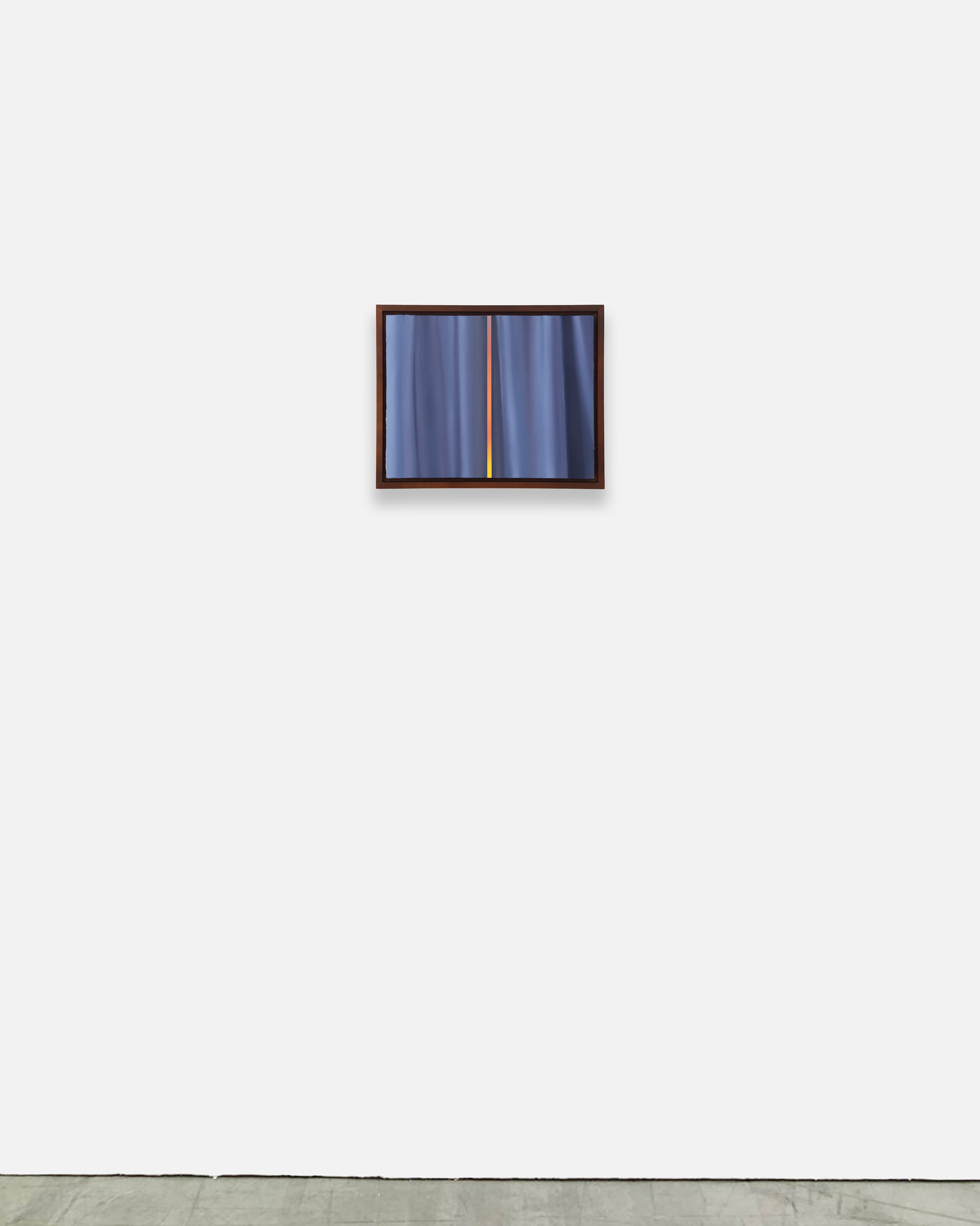 A picture of a window with a blue curtain in it.