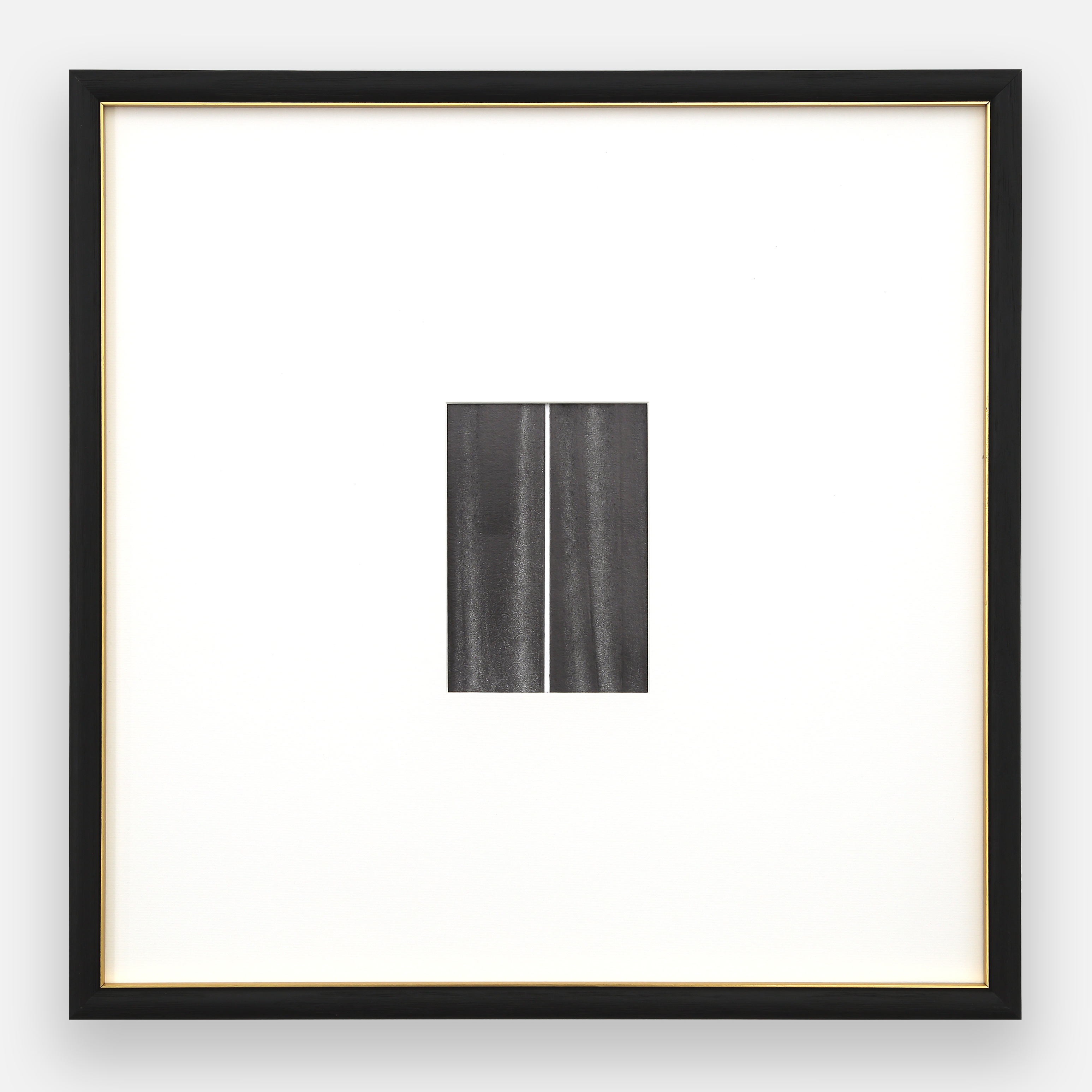 A black and white photo of a black frame on a white wall.