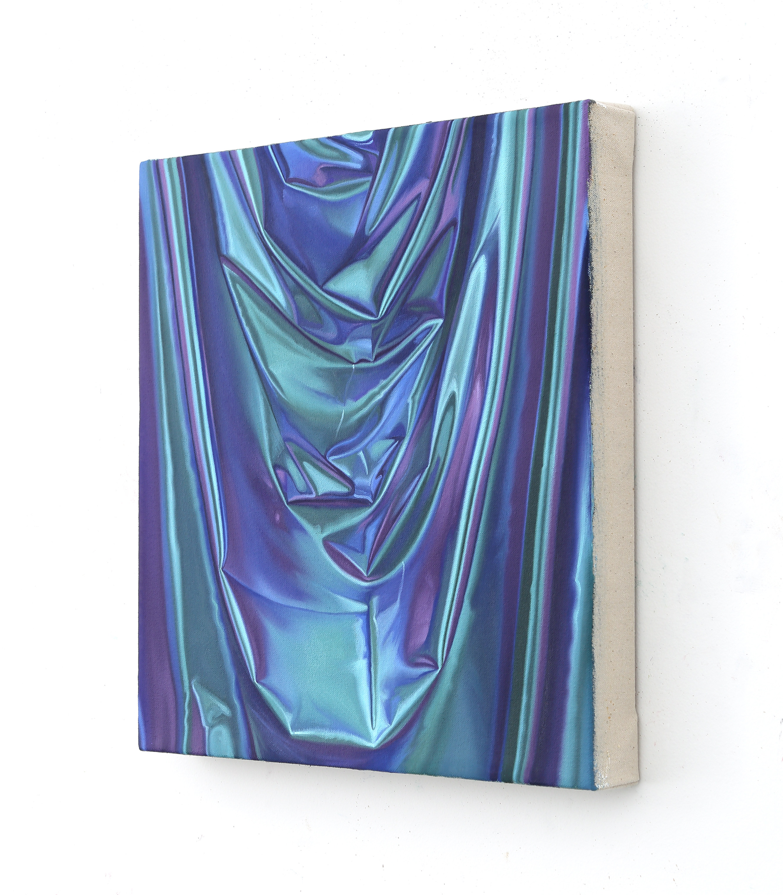 a close up of a blue and purple fabric on a white background