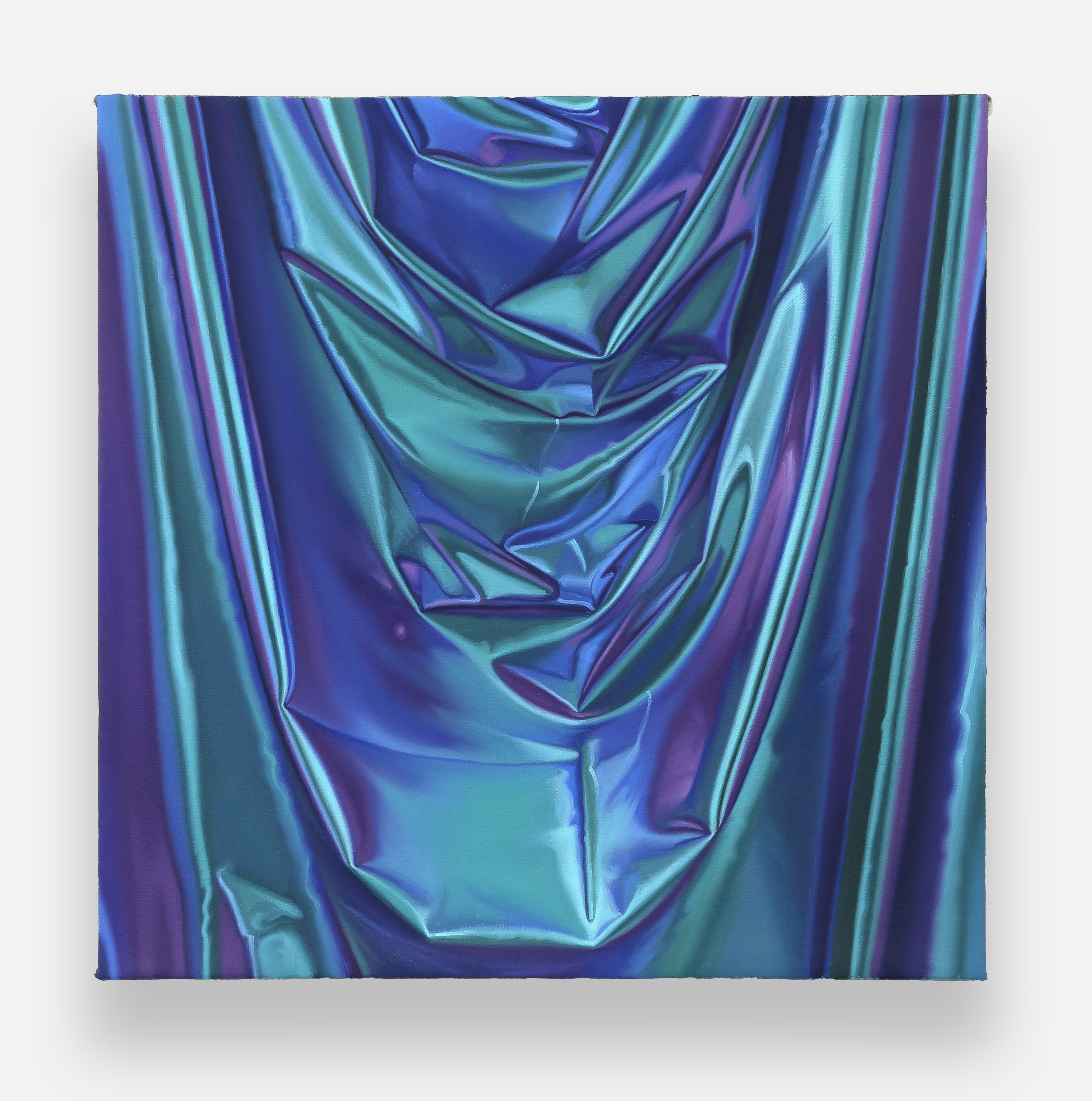 a close up of a blue and purple fabric on a white background