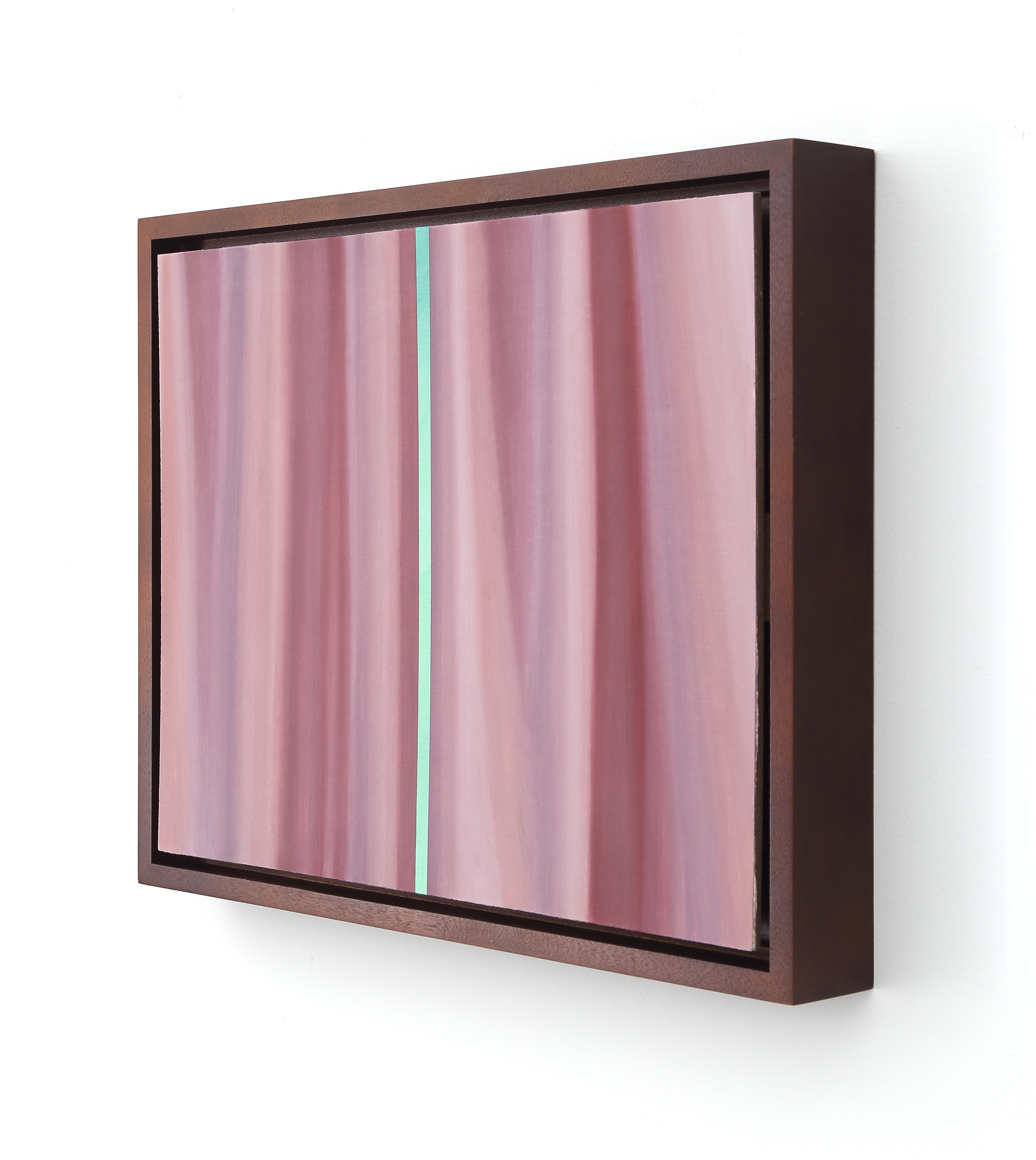 A picture of a pink curtain with a green stripe on it.