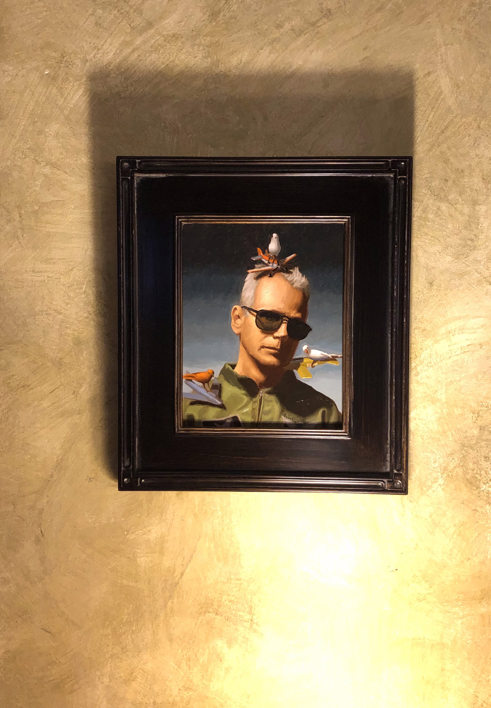 A painting of a man with birds on his head.